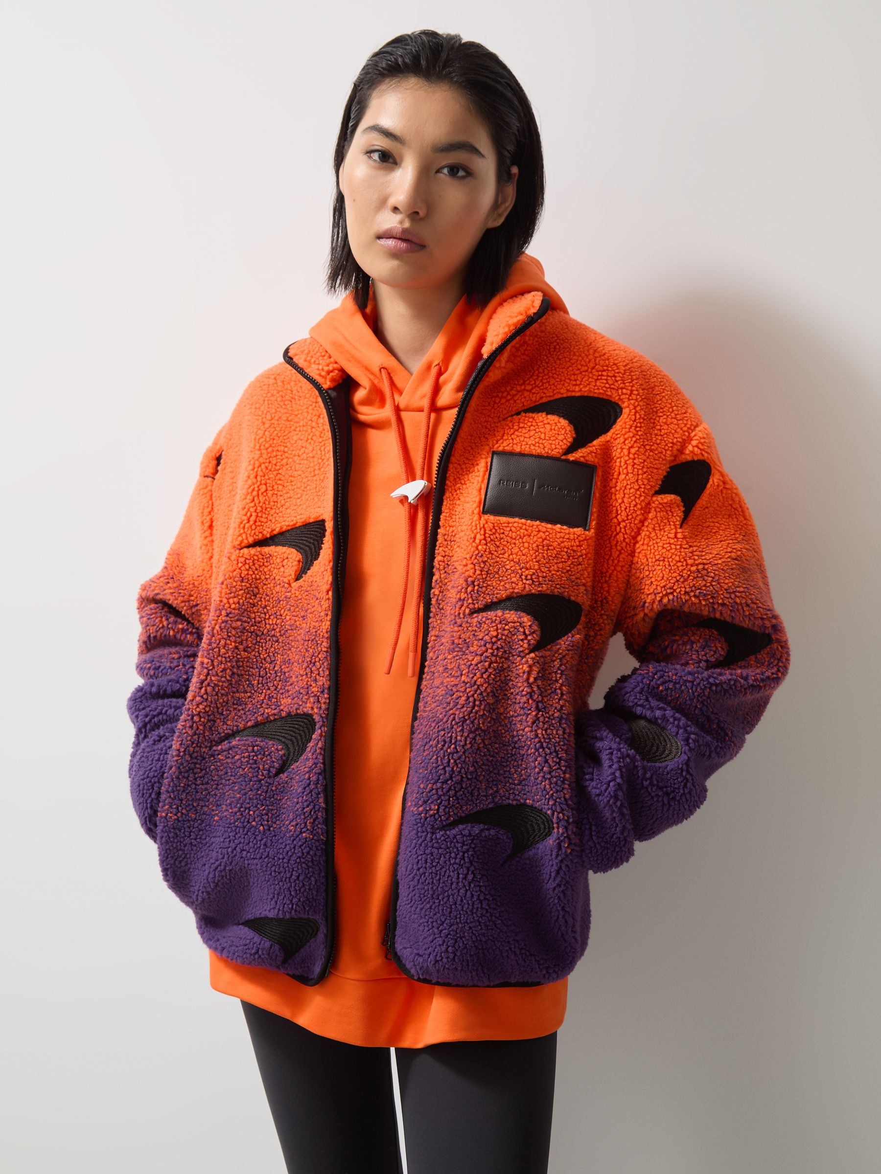 Unisex Fit McLaren F1 Team Ombré Fleece Jacket in Papaya Orange/Purple