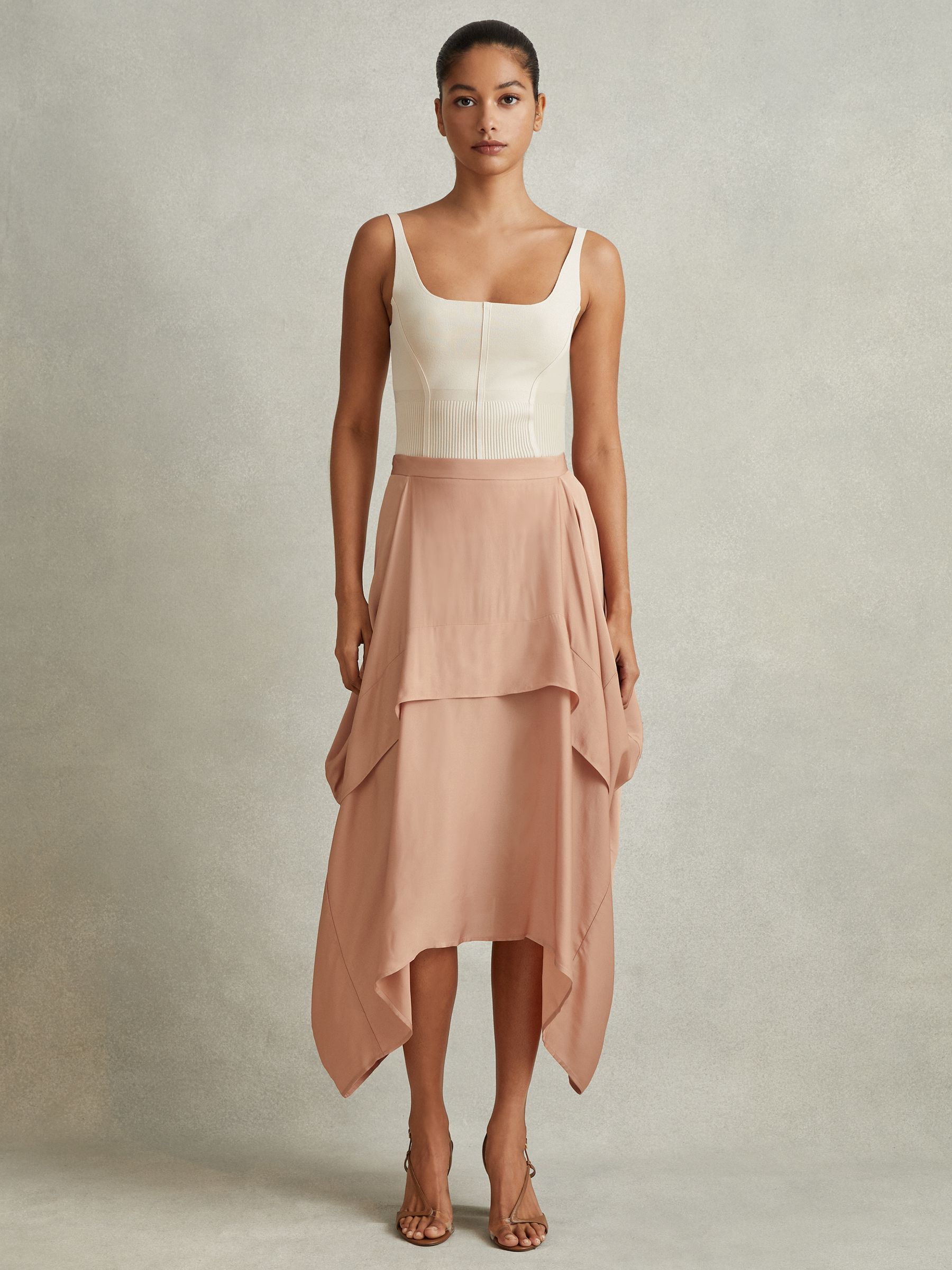 Side Pleat Asymmetric Midi Skirt in Nude
