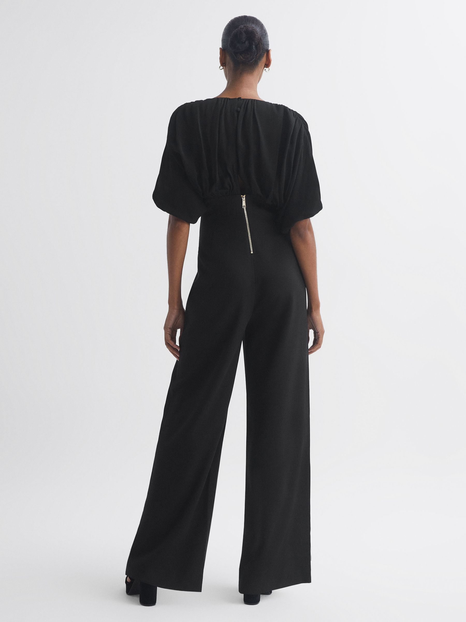 Florere Plunge Neck Wide Leg Jumpsuit in Black