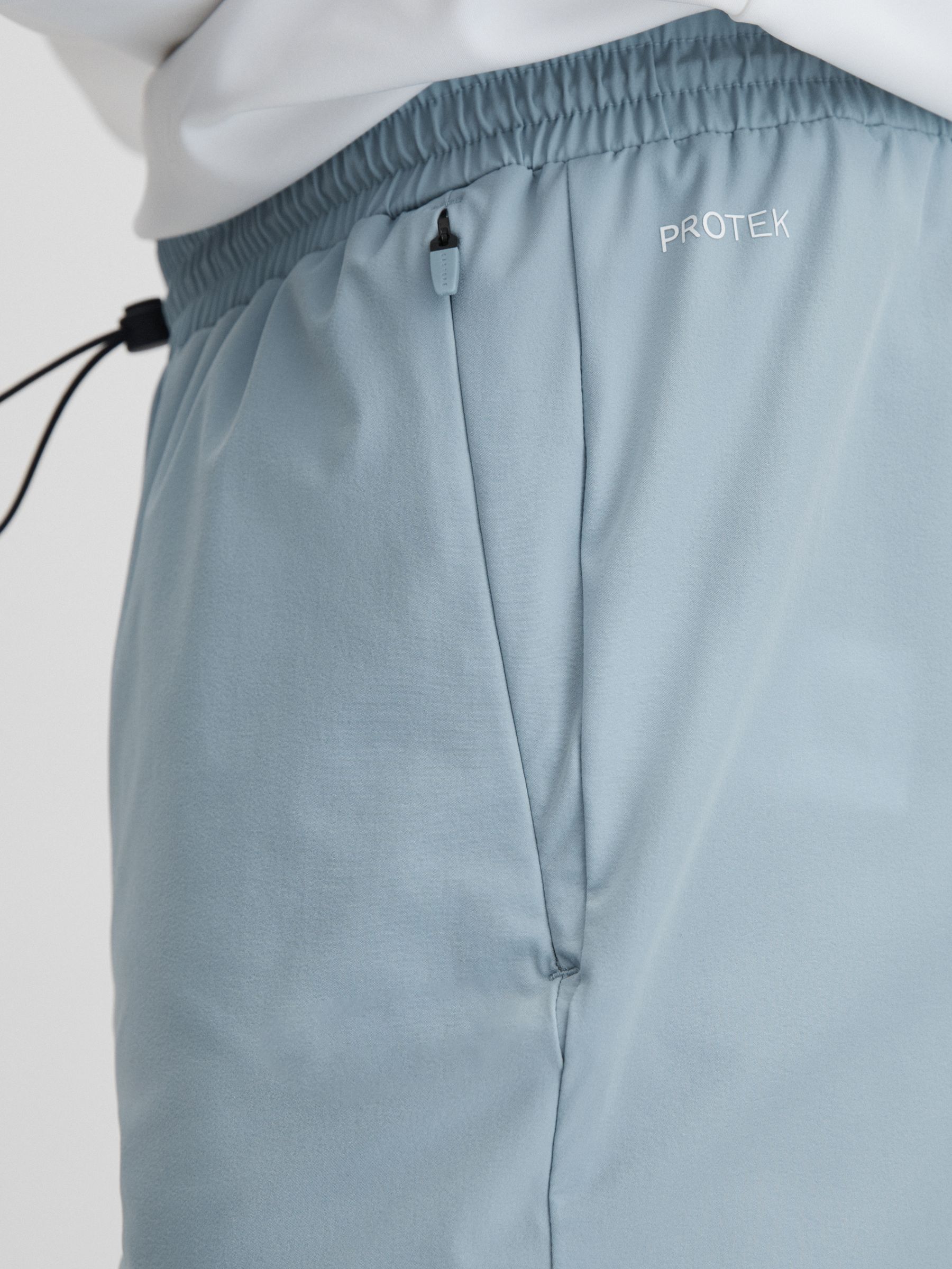 Castore Water Repellent Track Joggers in Blue Silver