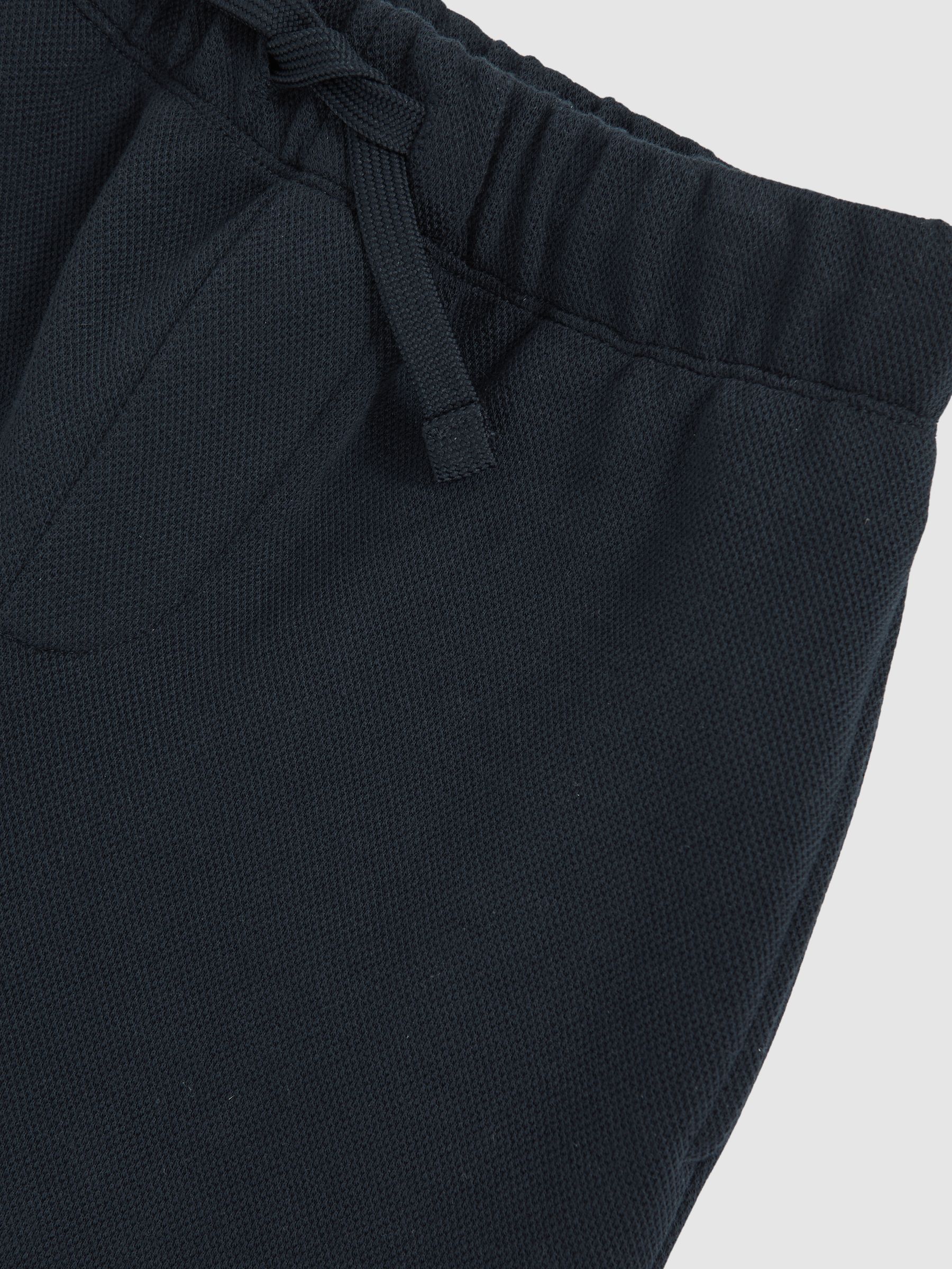Cotton-Blend Textured Cuffed Joggers in Navy