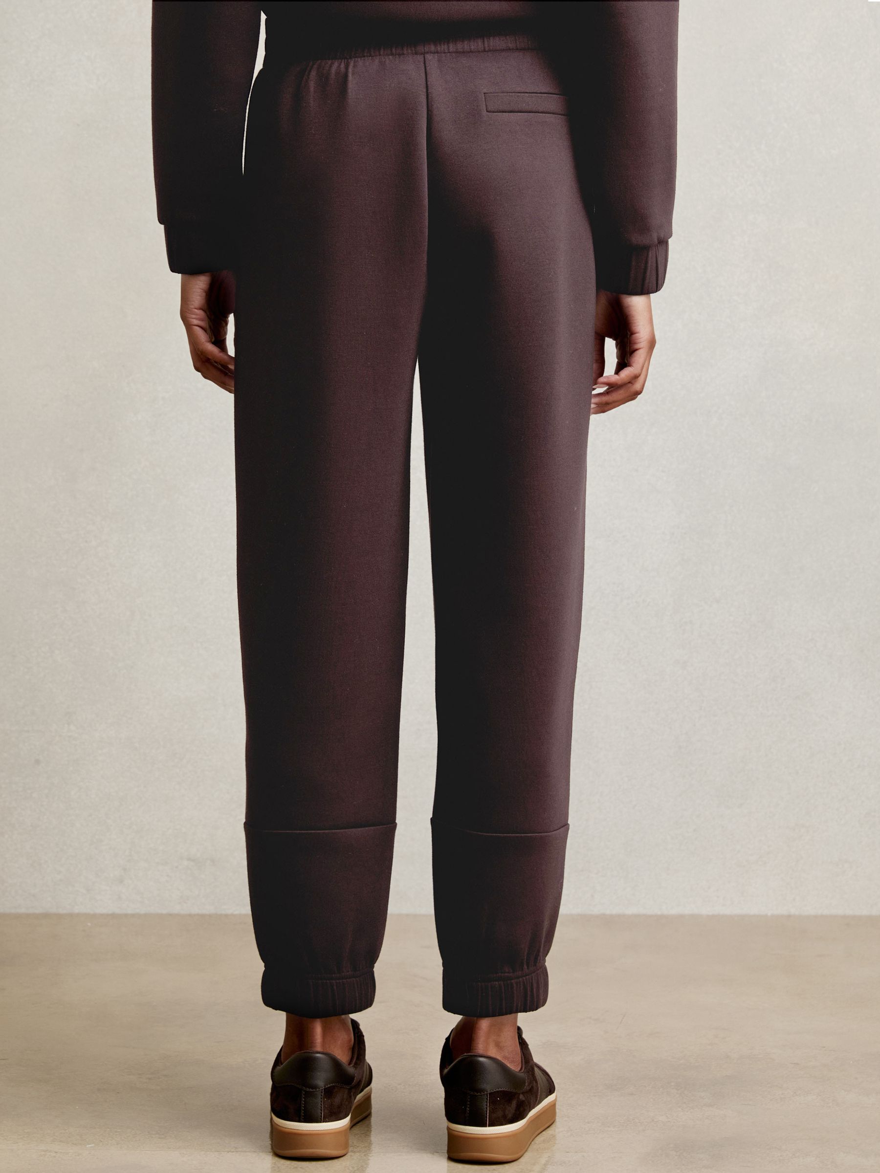 Interlock Tapered Joggers in Plum