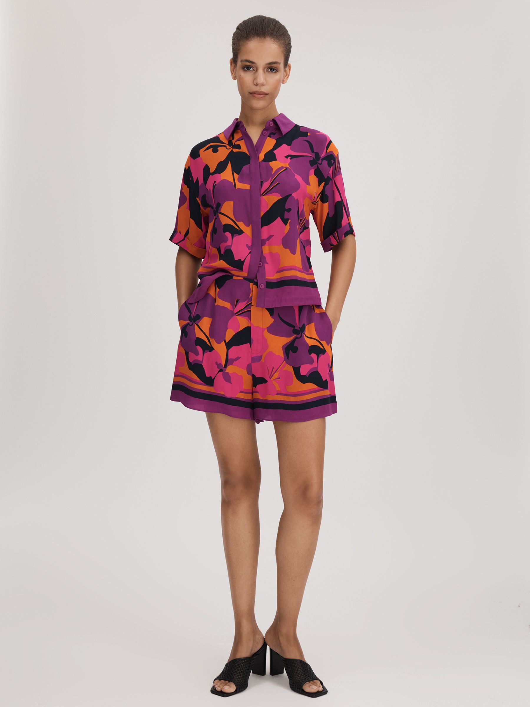 Florere Printed High Rise Shorts in Pink/Orange
