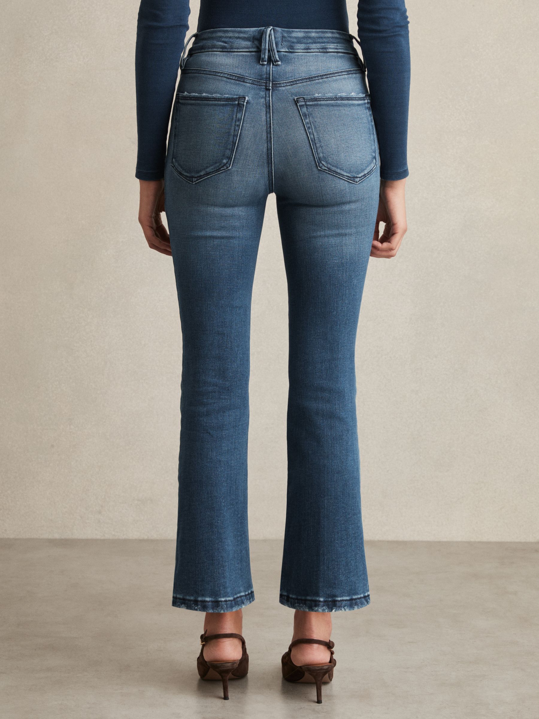 Good American Cropped Bootcut Jeans in Indigo