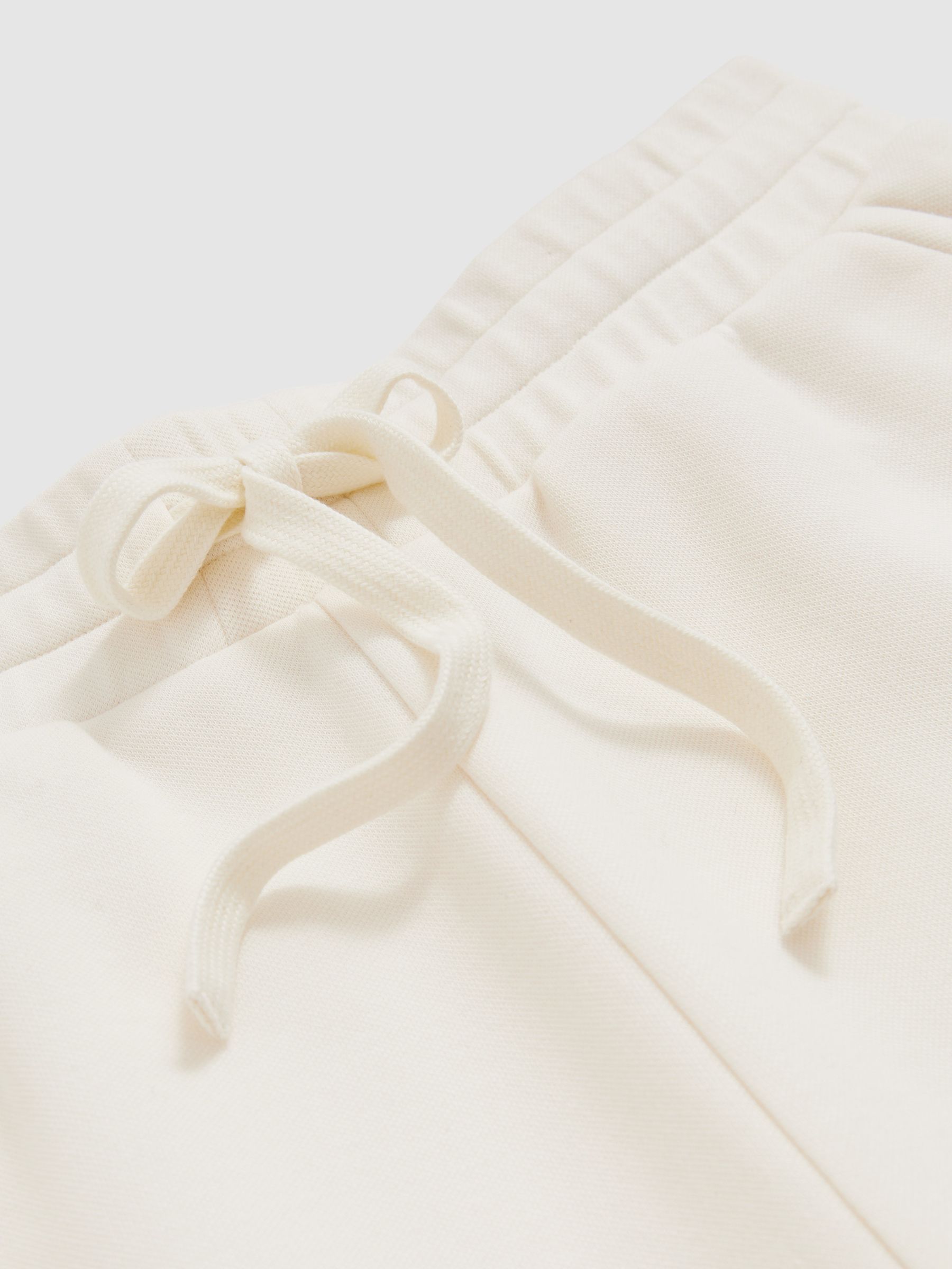 Cotton-Blend Interlock Wide-Leg Joggers in Ivory