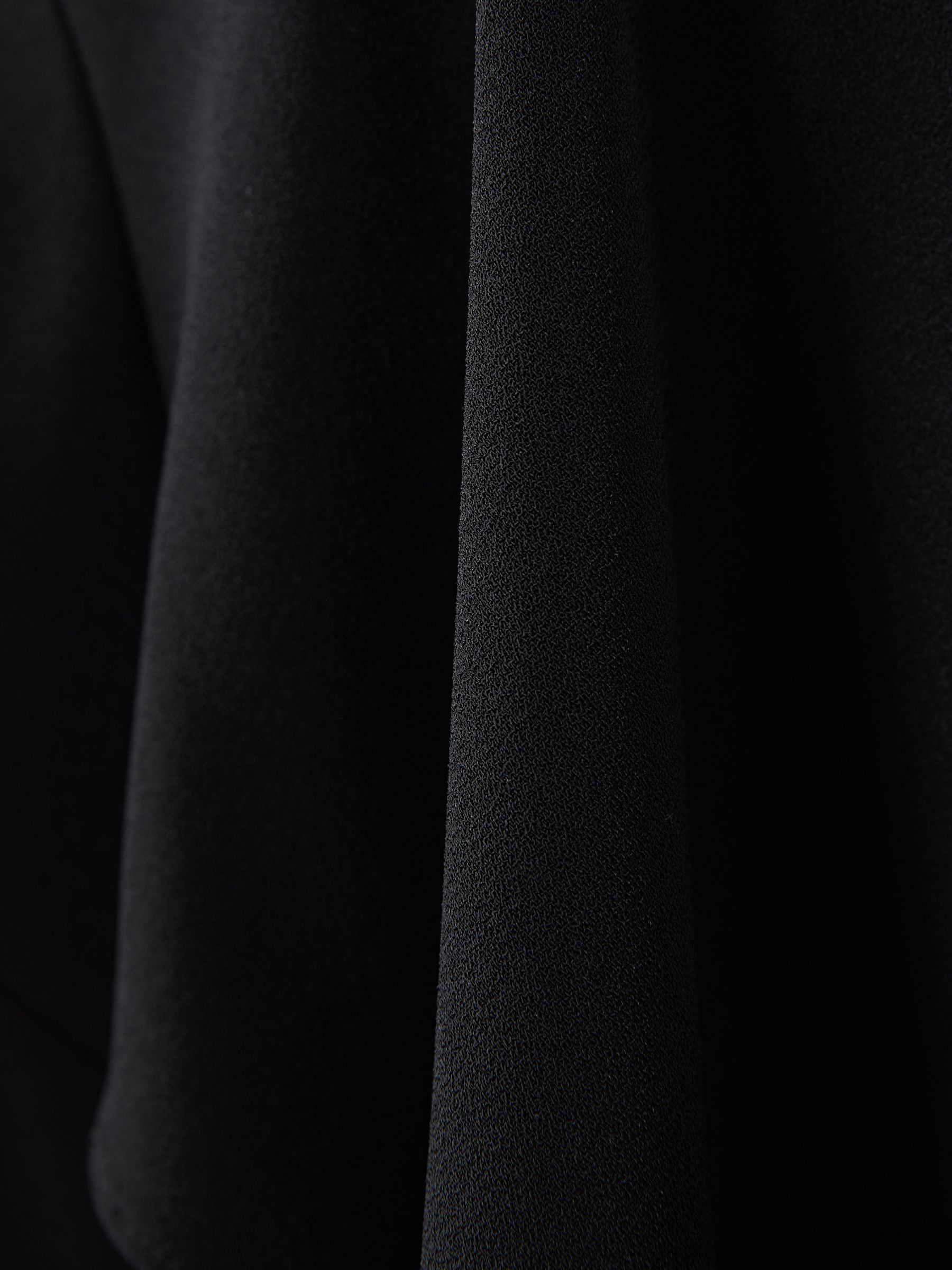 Florere Relaxed Fit Cape Sleeve Jumpsuit in Black