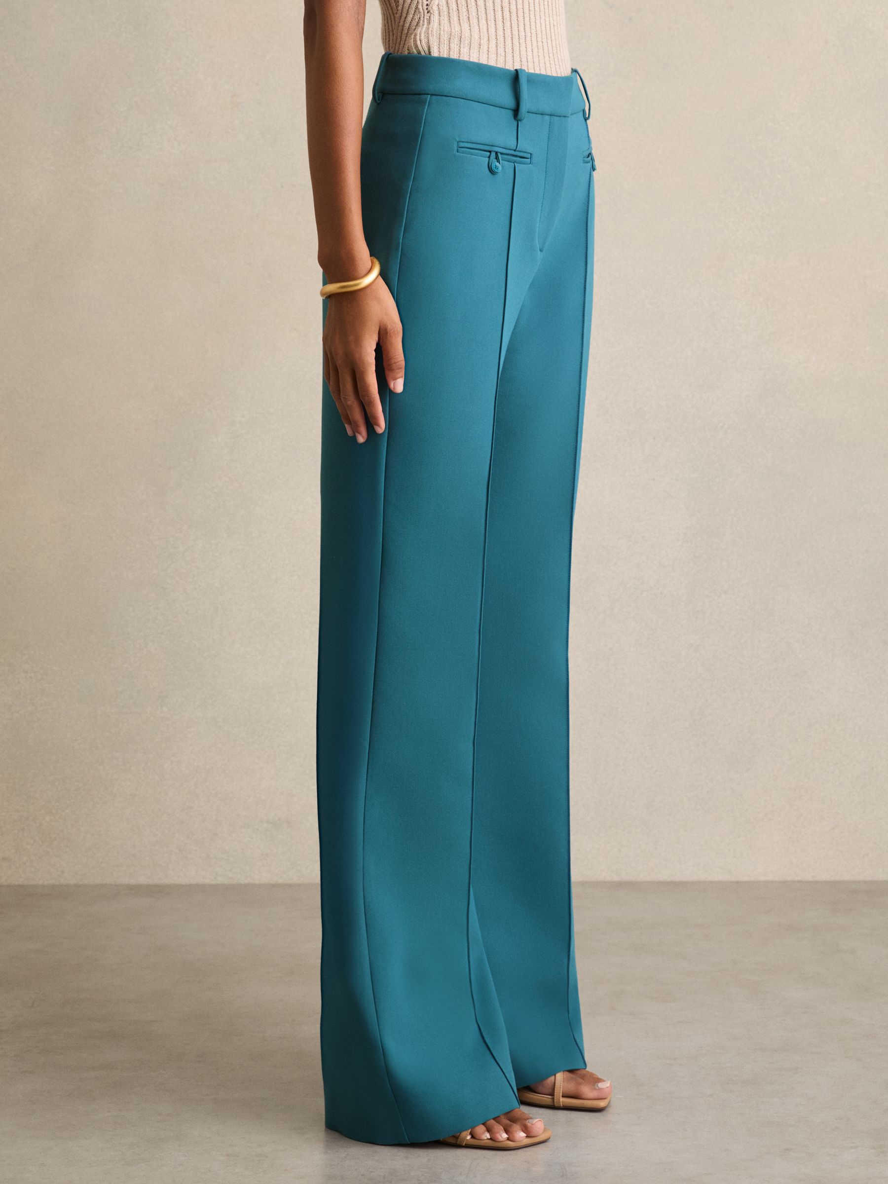 Welt Pocket Flared Trousers in Teal