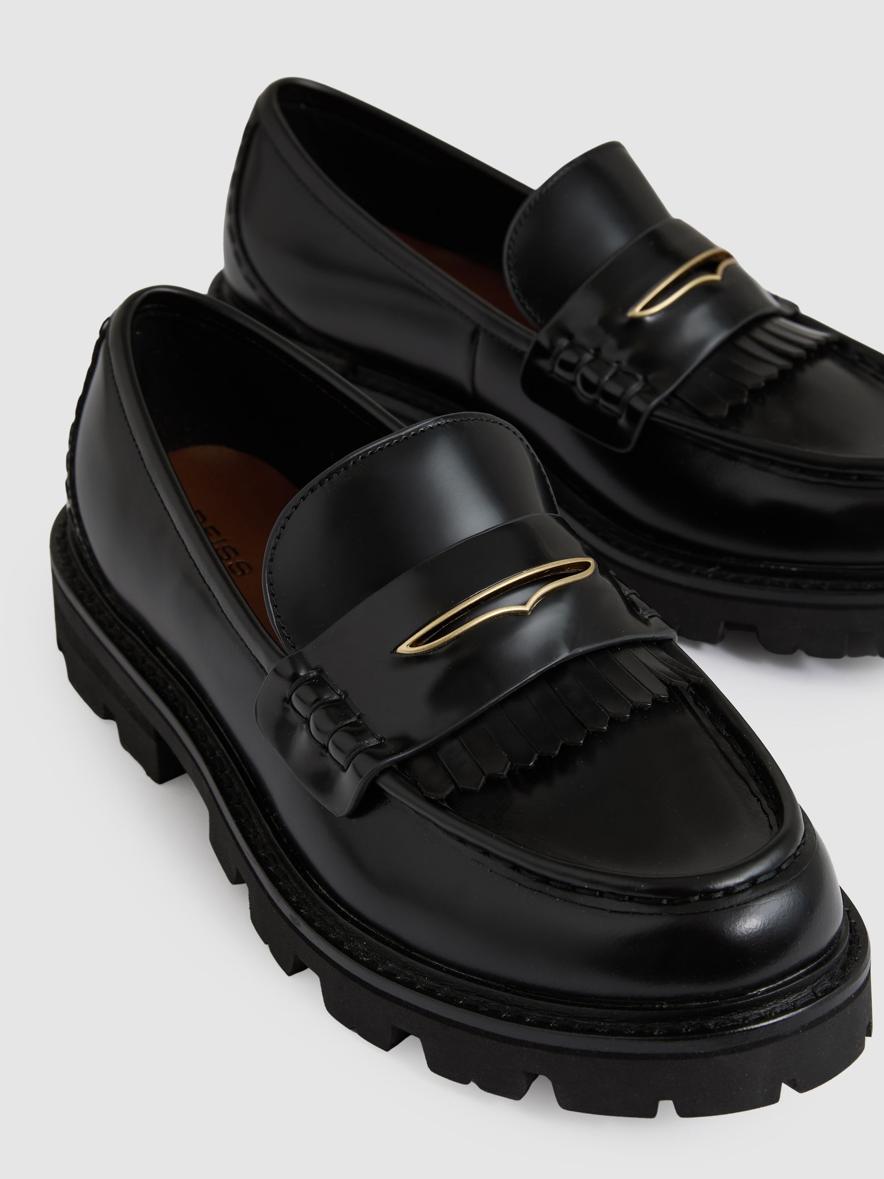 Leather Fringed Chunky Penny Loafers in Black