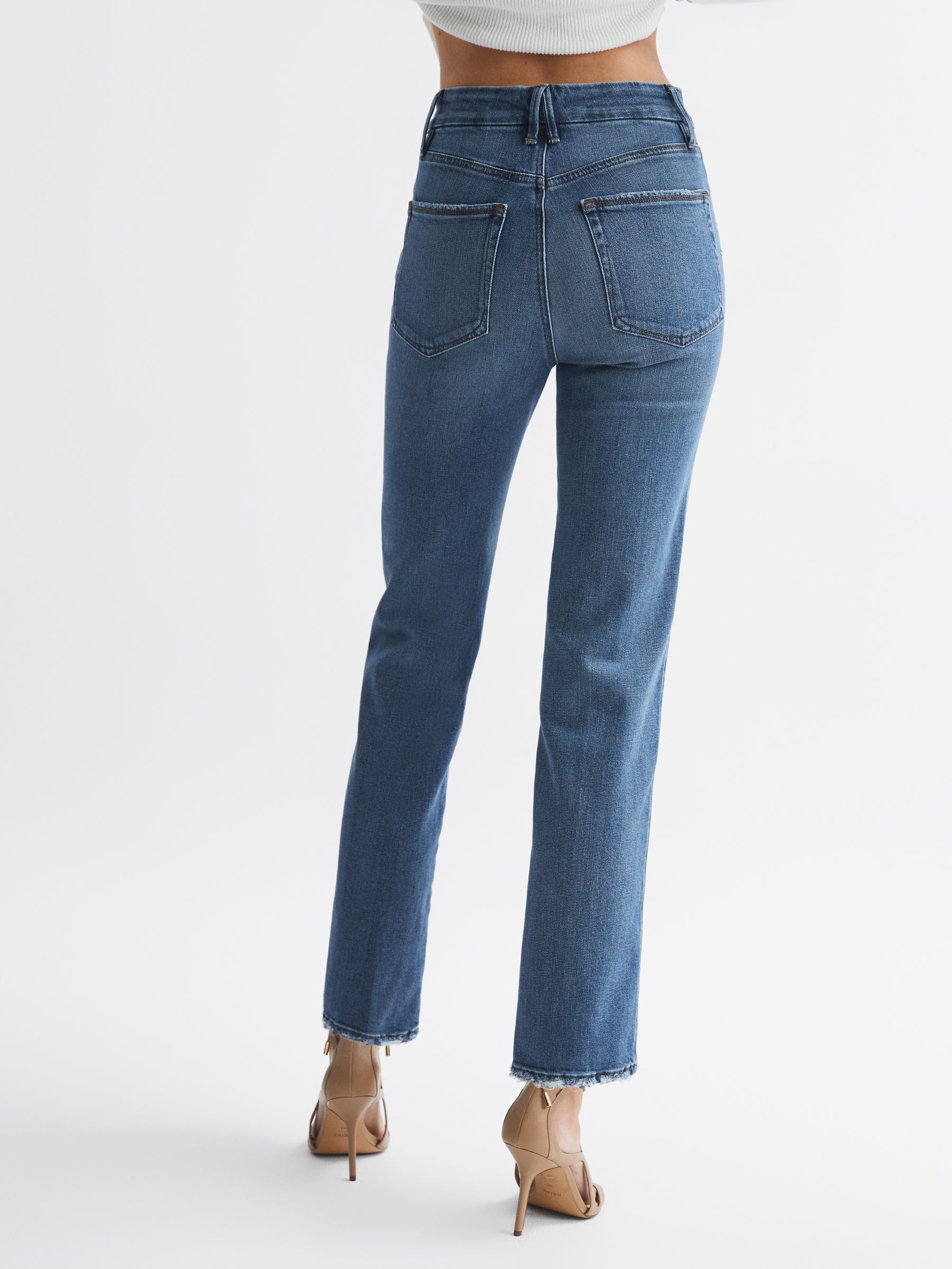 Good American Distressed Straight Leg Jeans in Mid Blue
