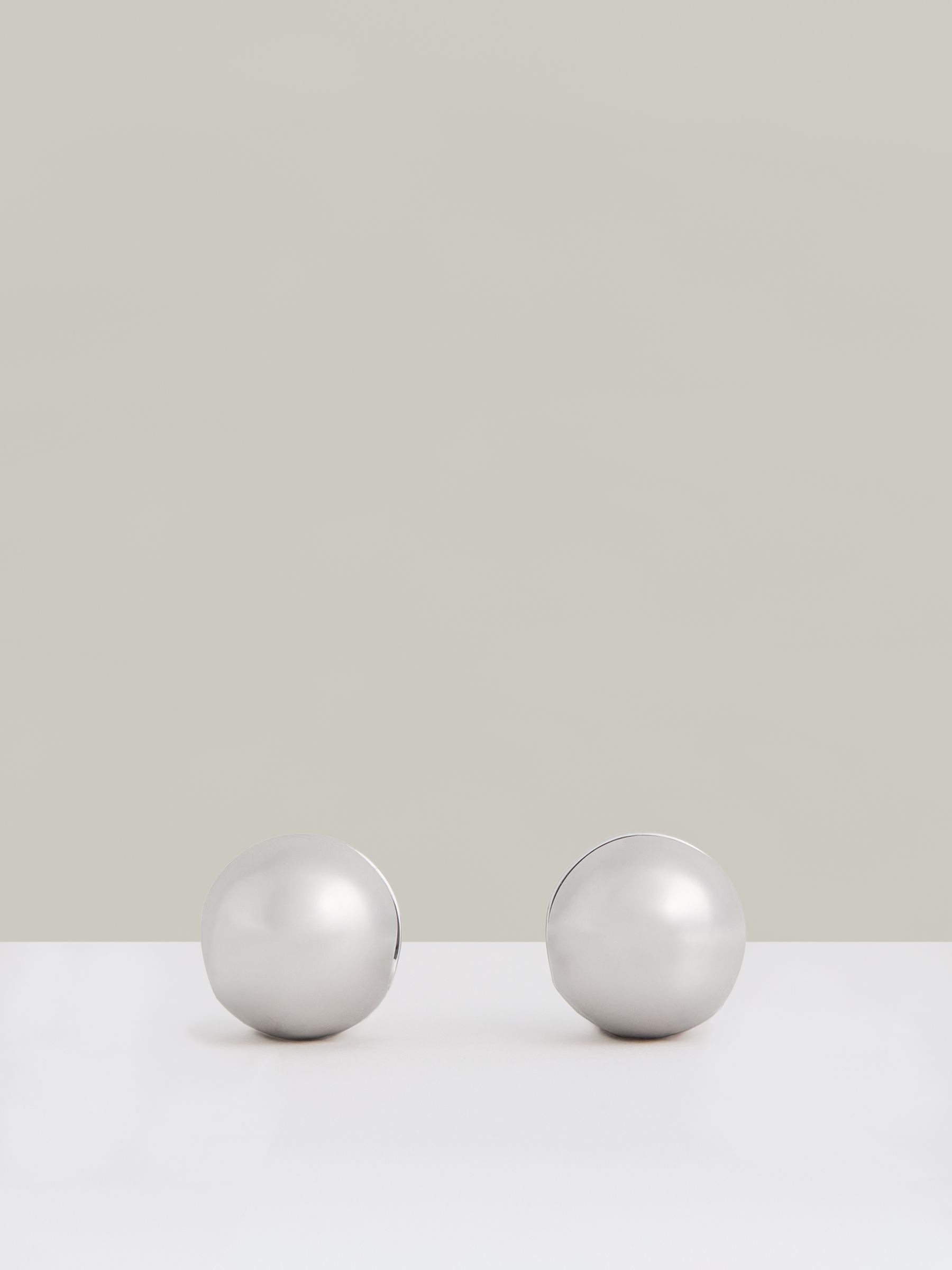 Polished Ball Huggie Earrings in Silver Tone