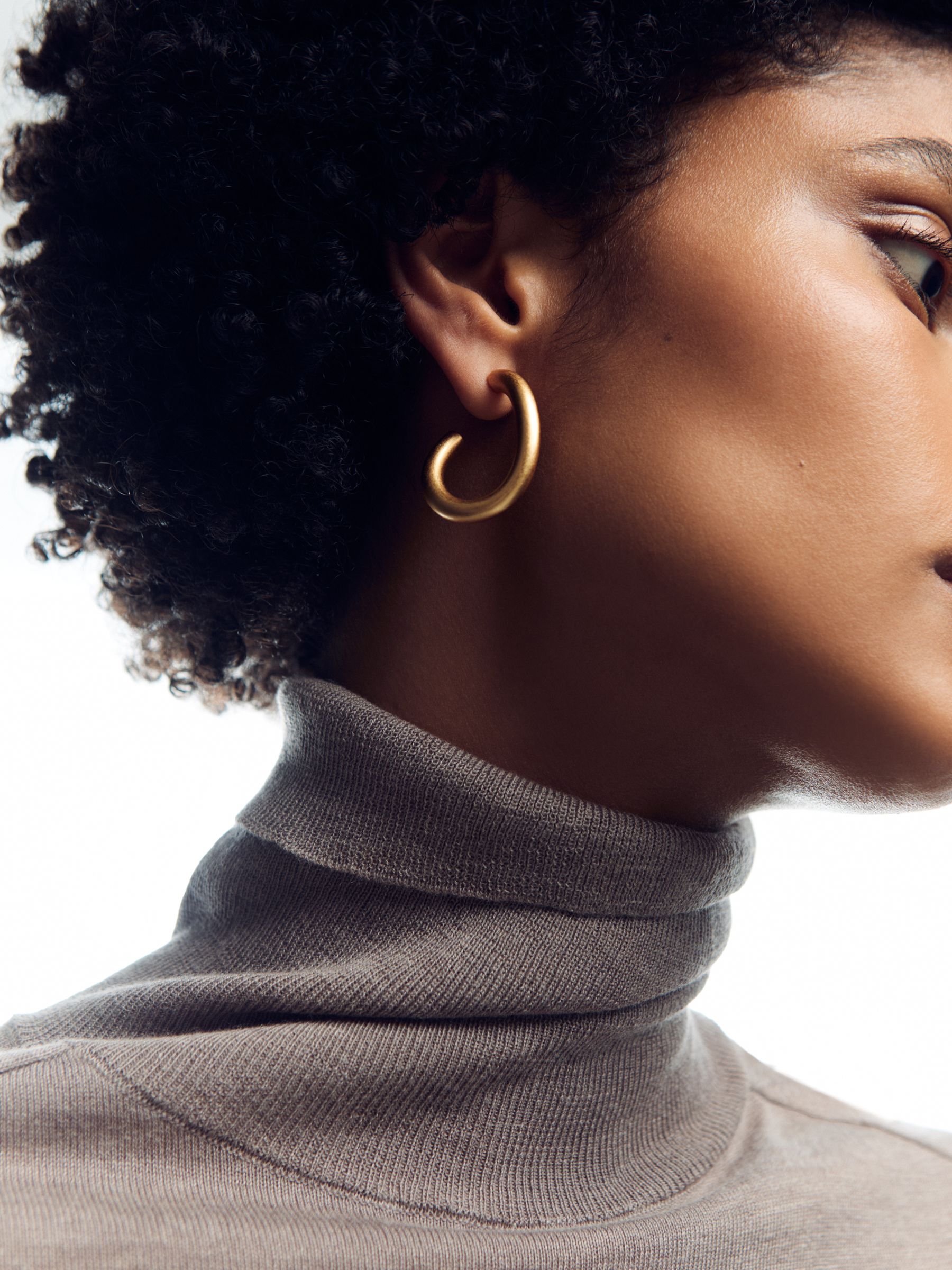 Wave Hoop Earrings in Gold Tone