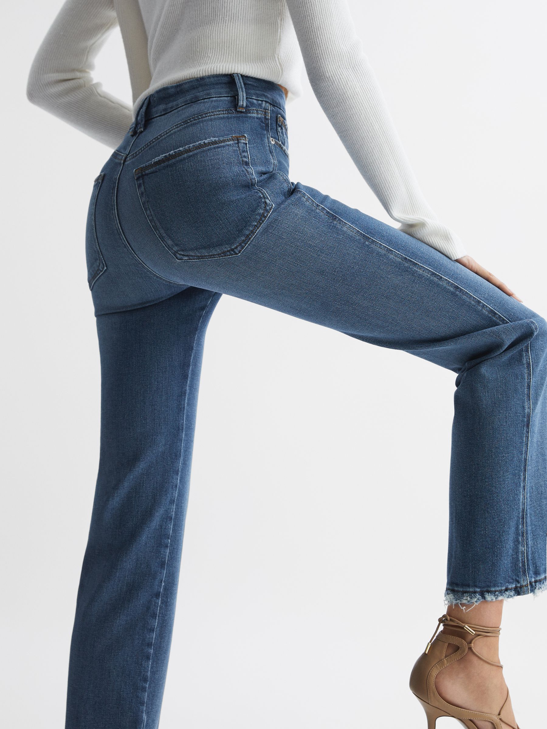 Good American Distressed Straight Leg Jeans in Mid Blue