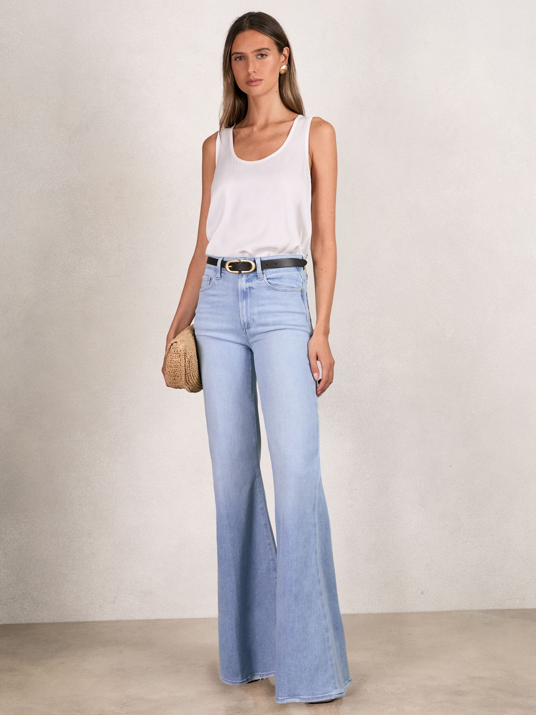 Paige Mid-Rise Flared Jeans in Light Blue