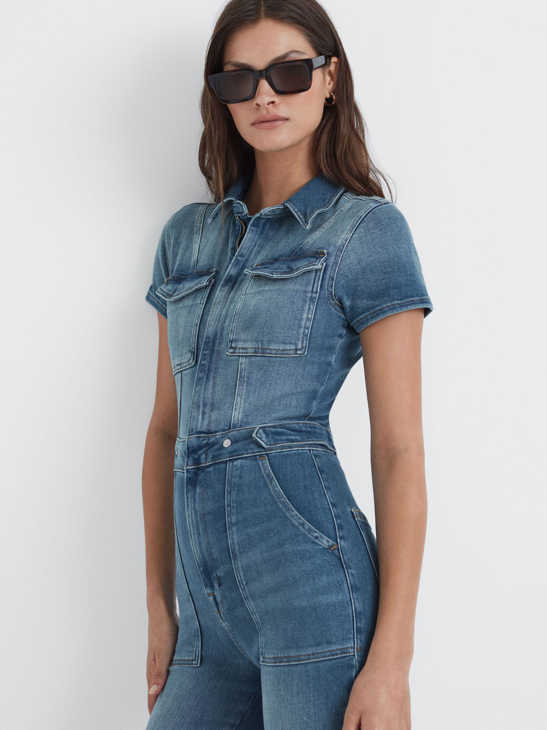 Good American Denim Bootcut Jumpsuit in Blue