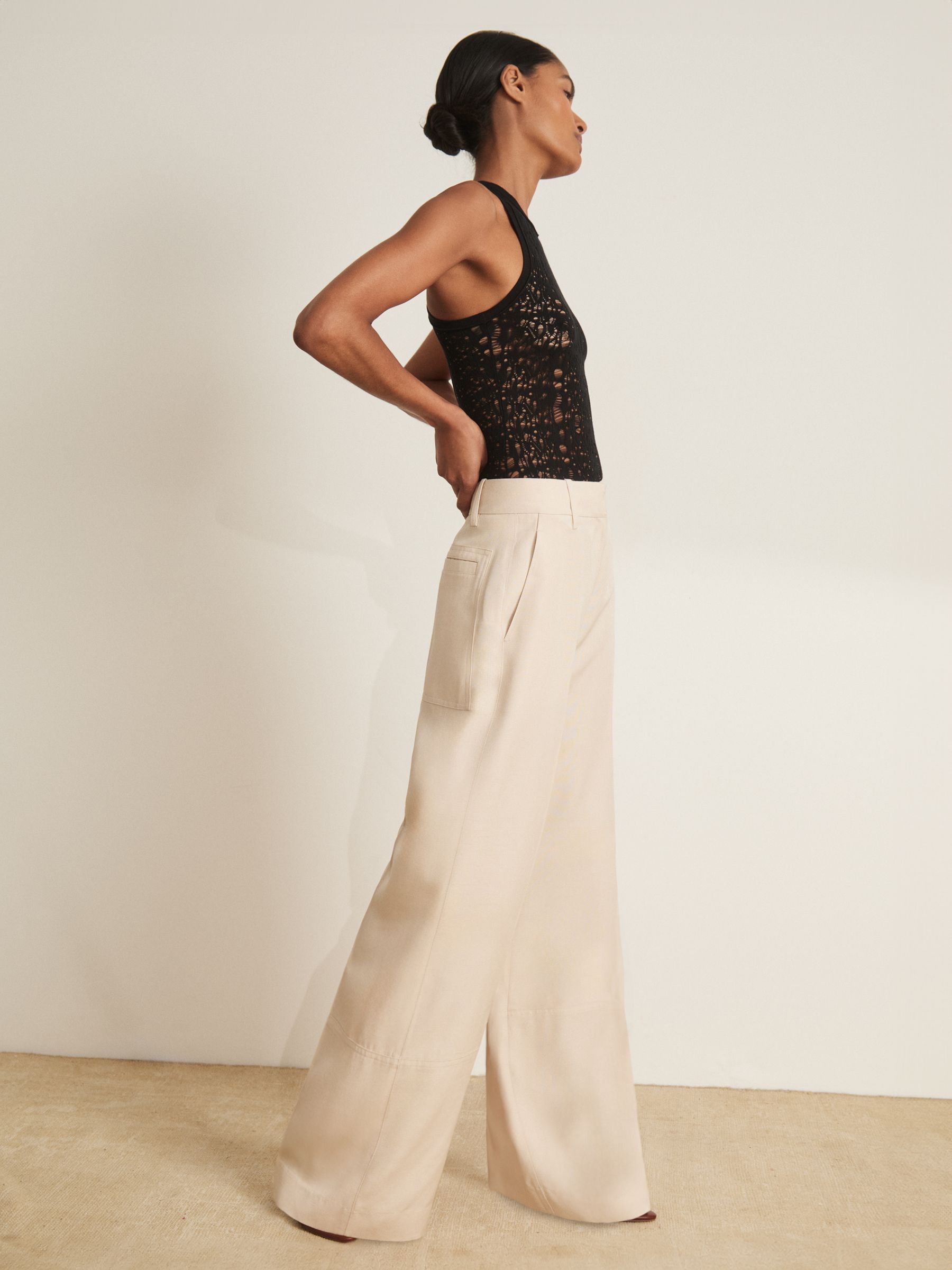 Atelier Lace-Knit High-Neck Bodysuit in Black