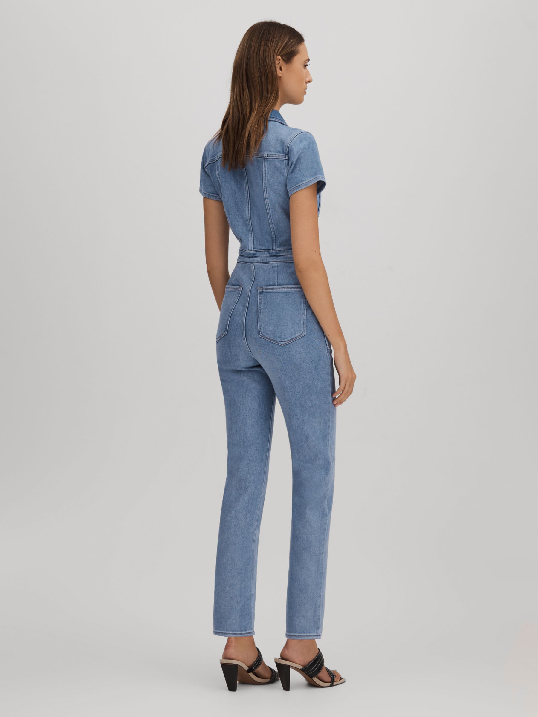 Good American Denim Skinny Jumpsuit in Mid Blue
