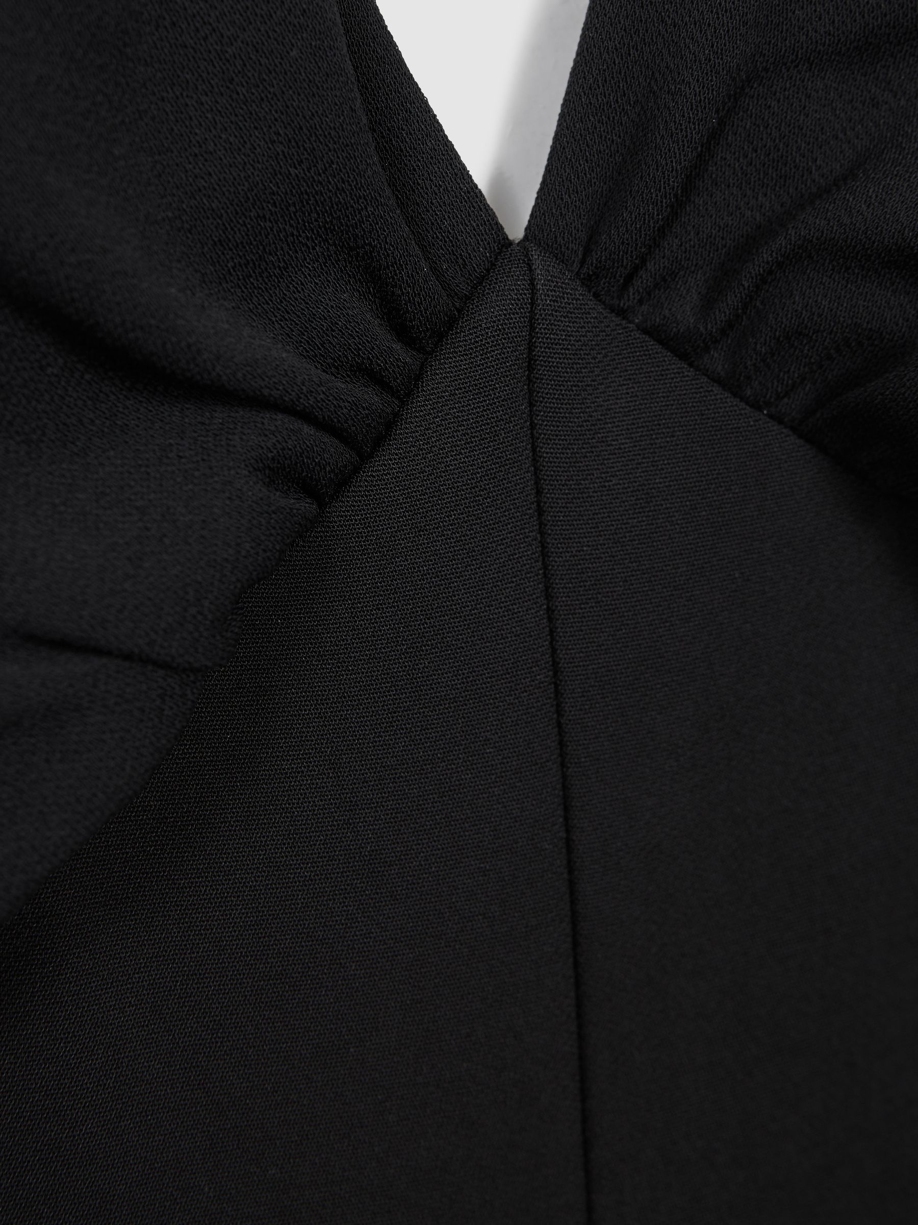 Florere Plunge Neck Wide Leg Jumpsuit in Black