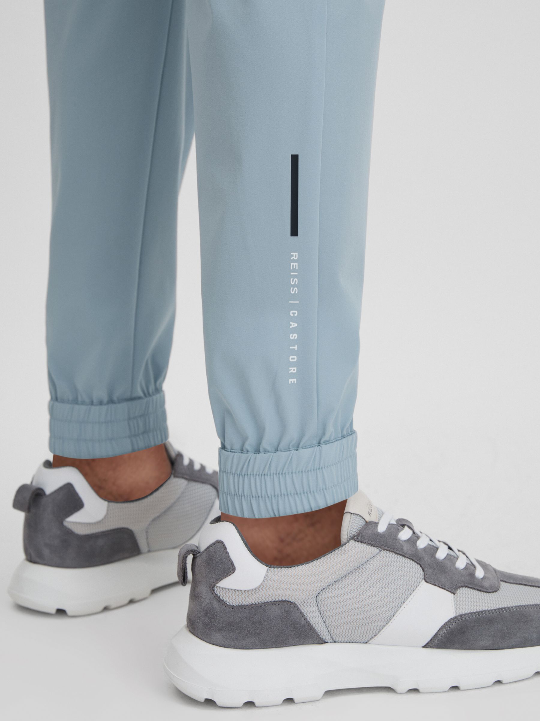 Castore Water Repellent Track Joggers in Blue Silver