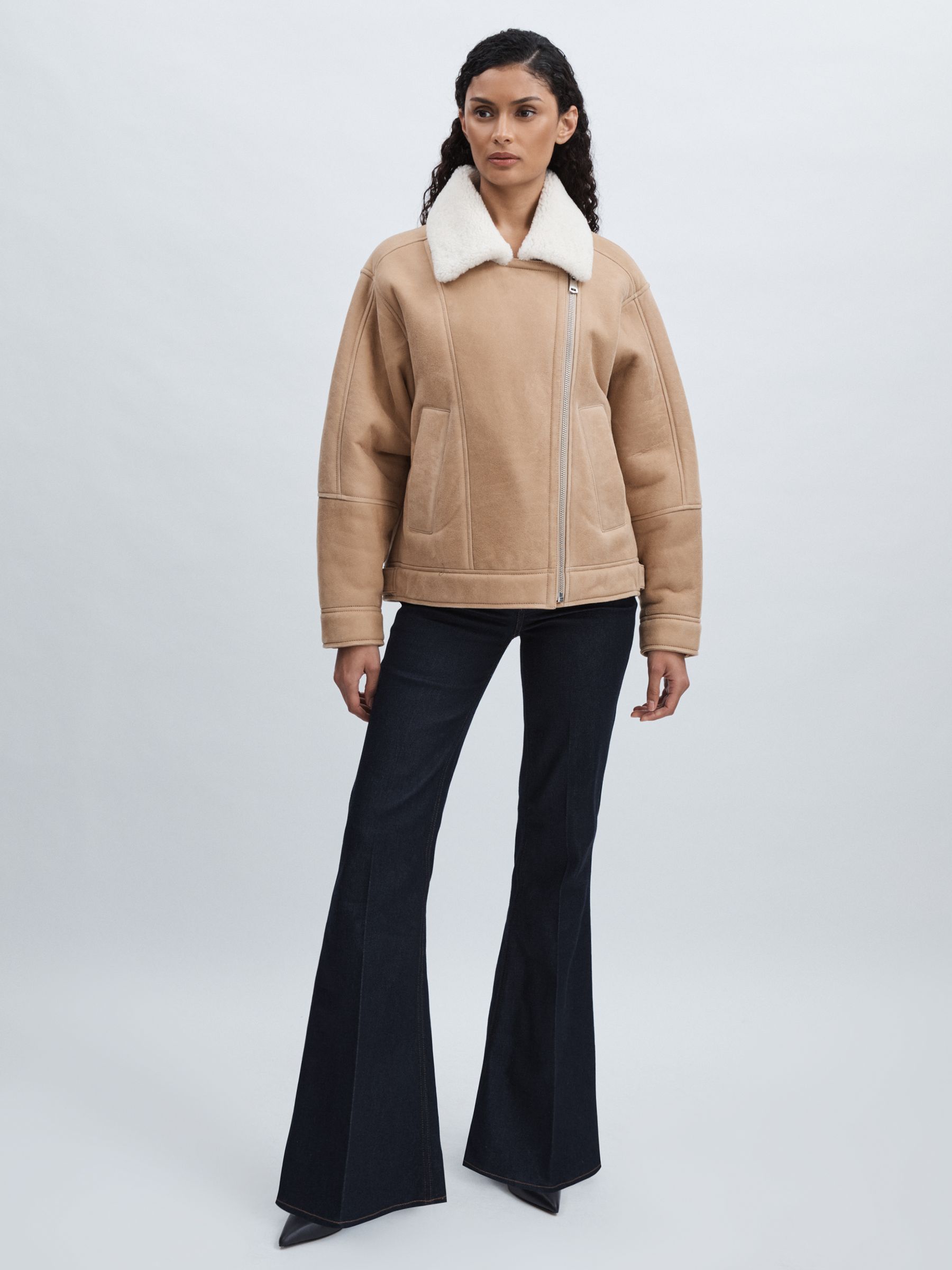 Paige Angled-Waist Flared Jeans in Kira Blue