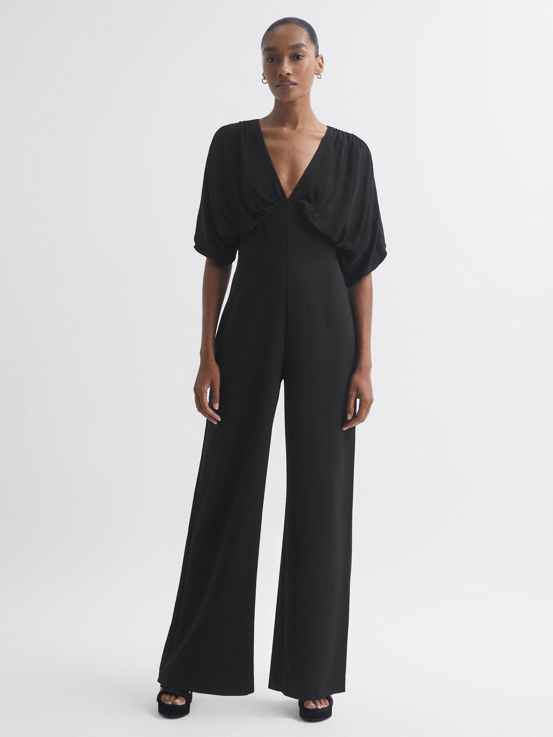 Florere Plunge Neck Wide Leg Jumpsuit in Black