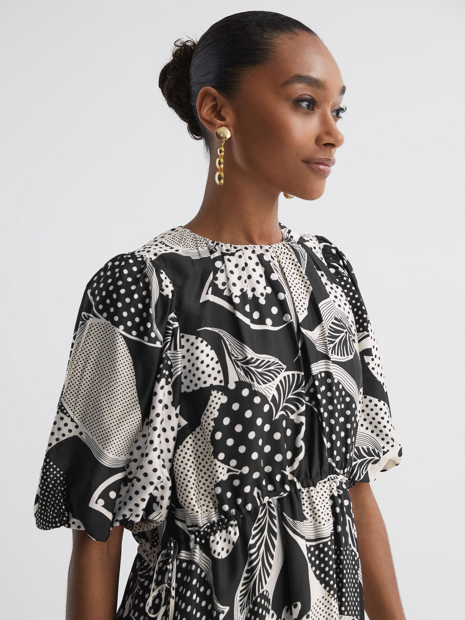 Florere Polka Dot Puff Sleeve Mini Dress in Black