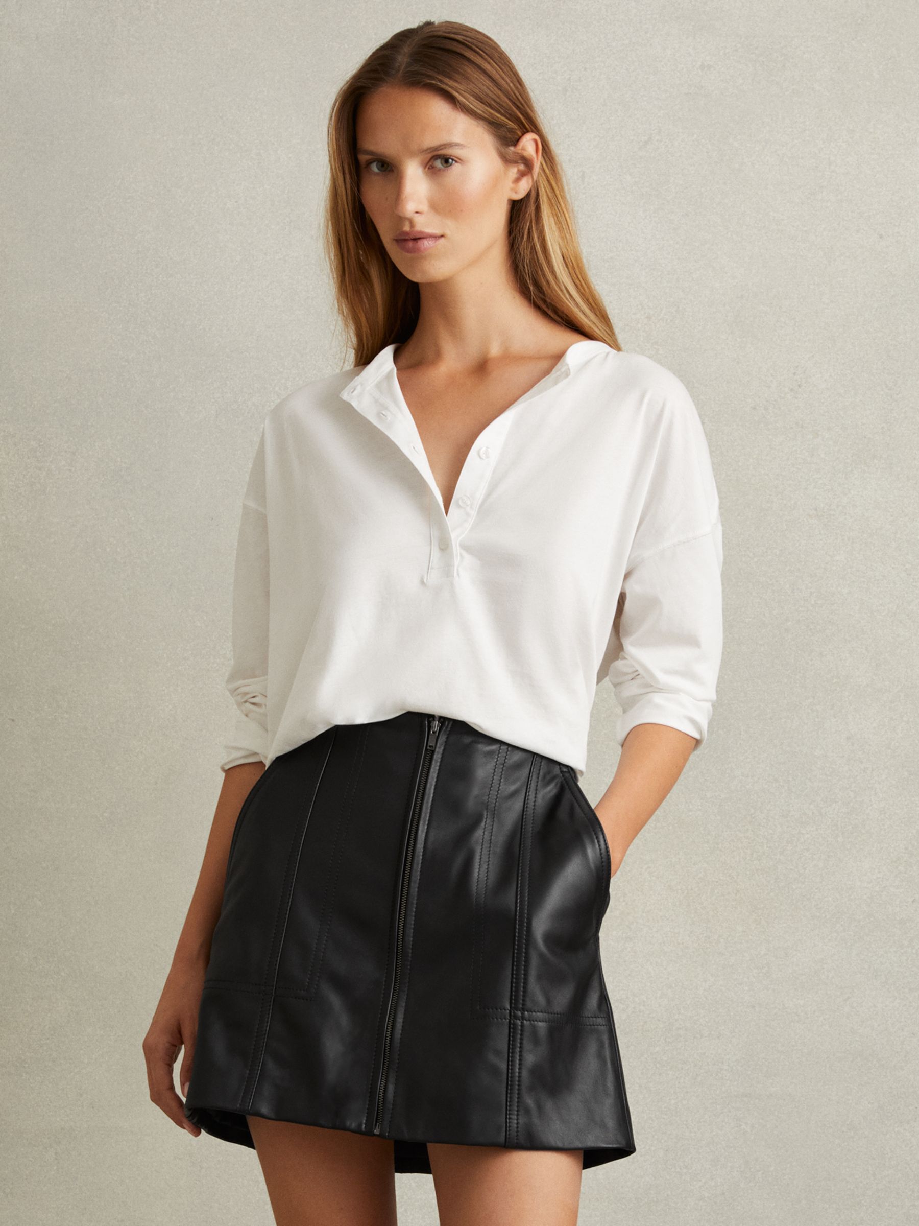 Leather Zip-Front Mini Skirt in Black