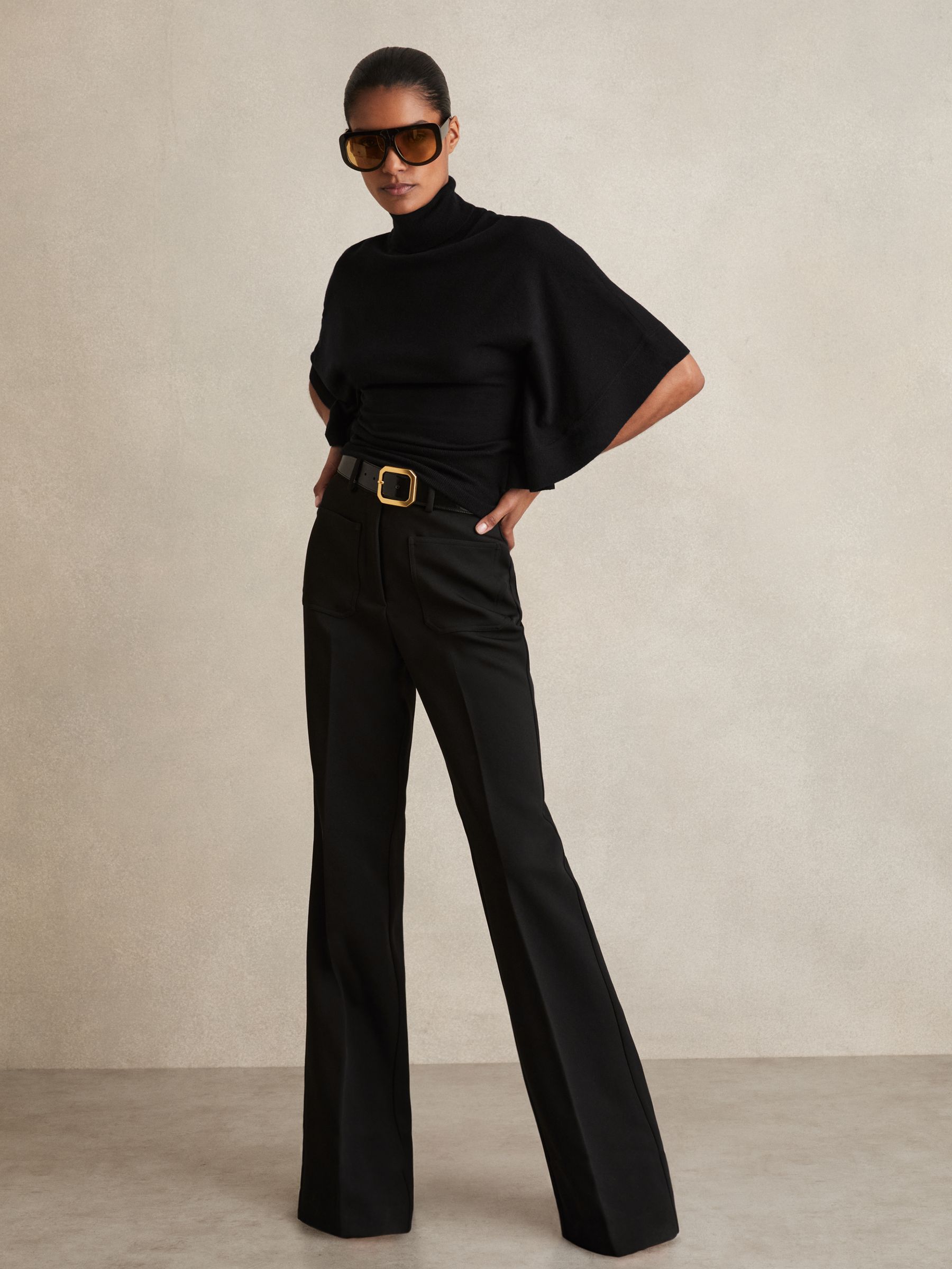 Merino Wool Batwing Roll-Neck Jumper in Black