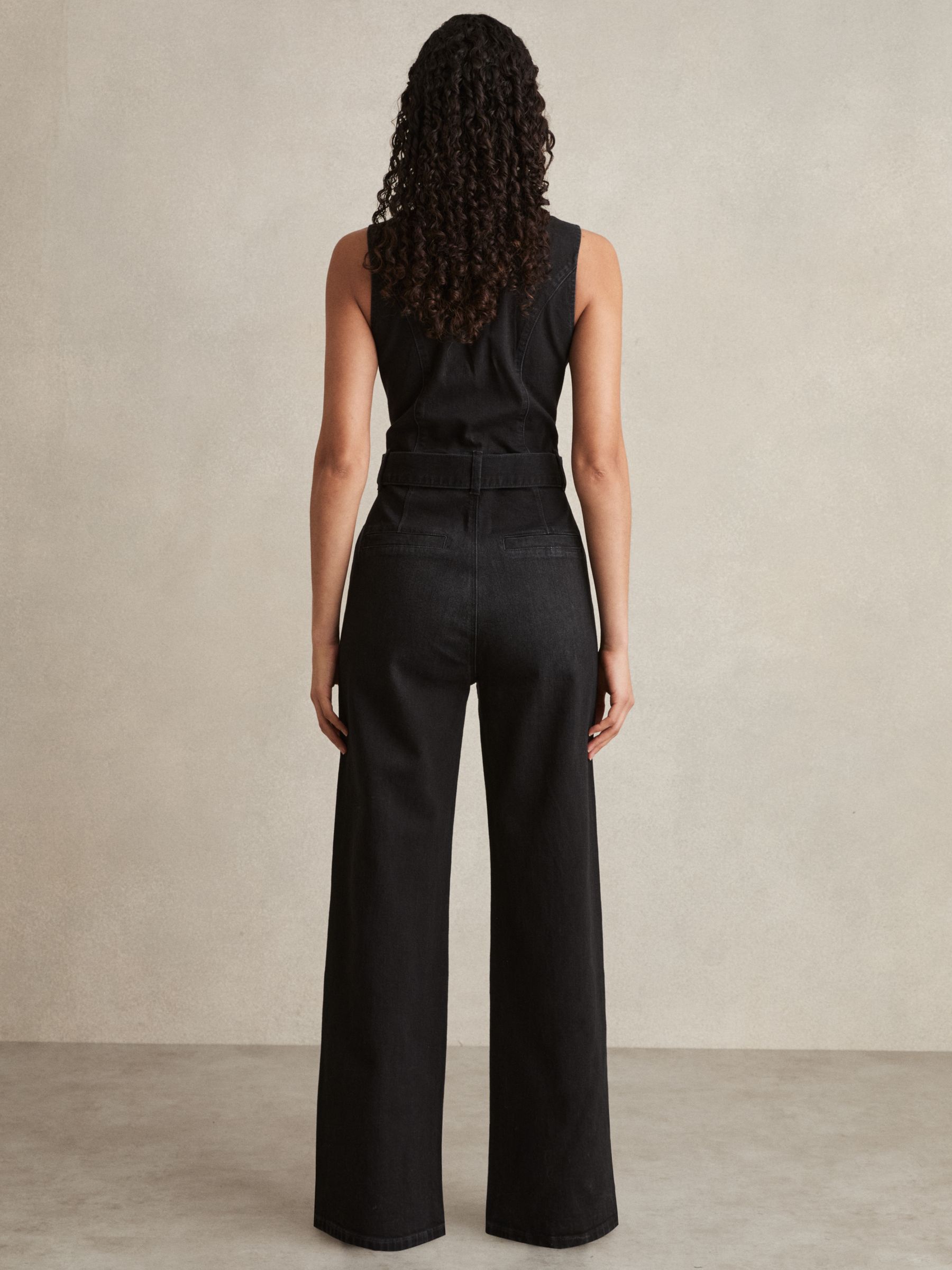 Paige Sleeveless Denim Jumpsuit in Washed Black