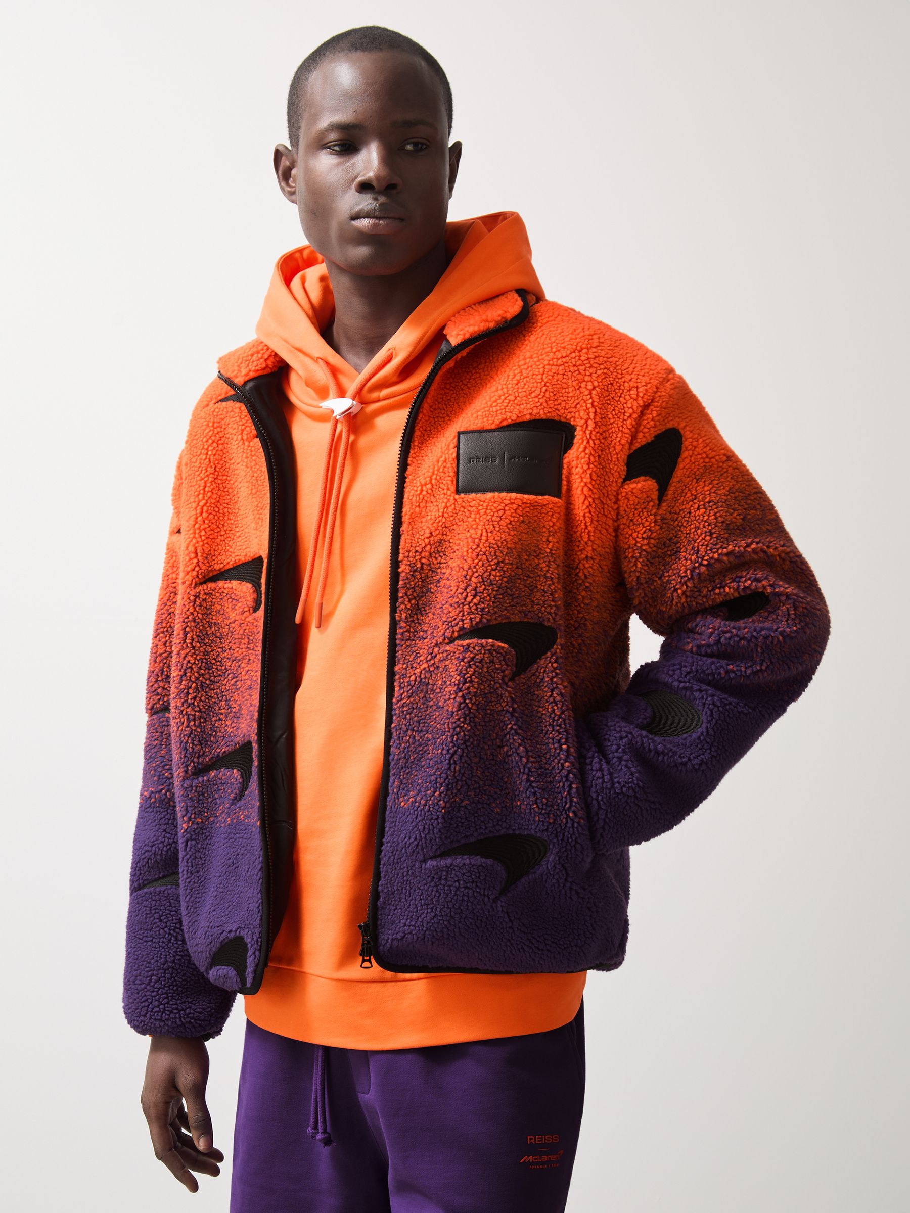 Unisex Fit McLaren F1 Team Ombré Fleece Jacket in Papaya Orange/Purple