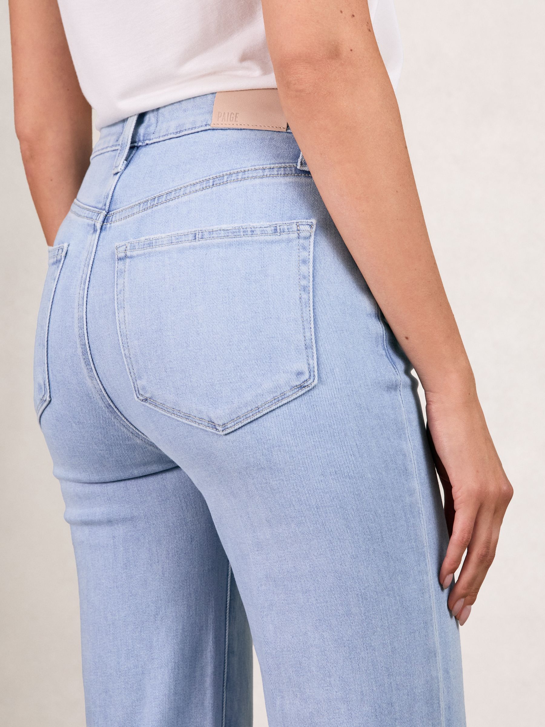 Paige Mid-Rise Flared Jeans in Light Blue