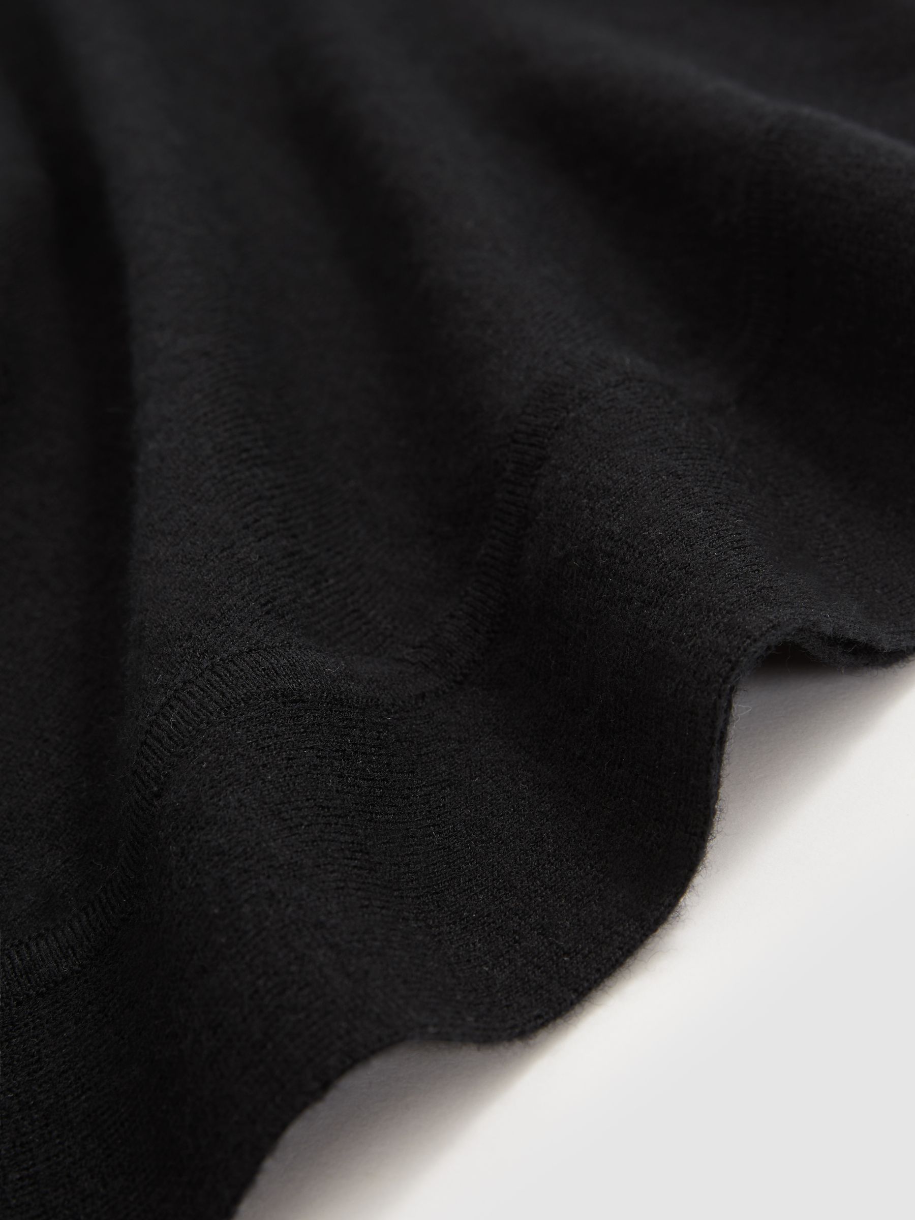 Merino Wool Batwing Roll-Neck Jumper in Black
