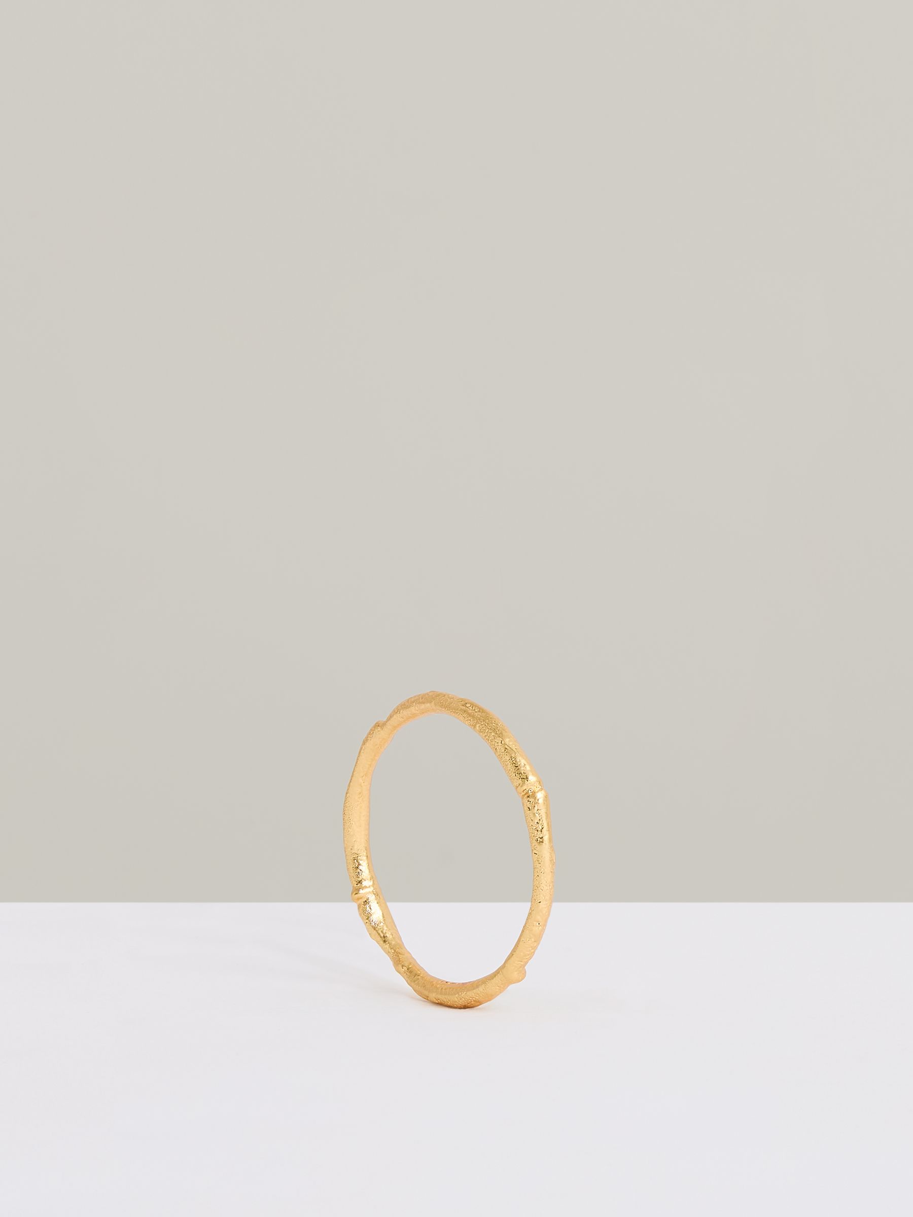 Molten Curve Bangle in Gold Tone