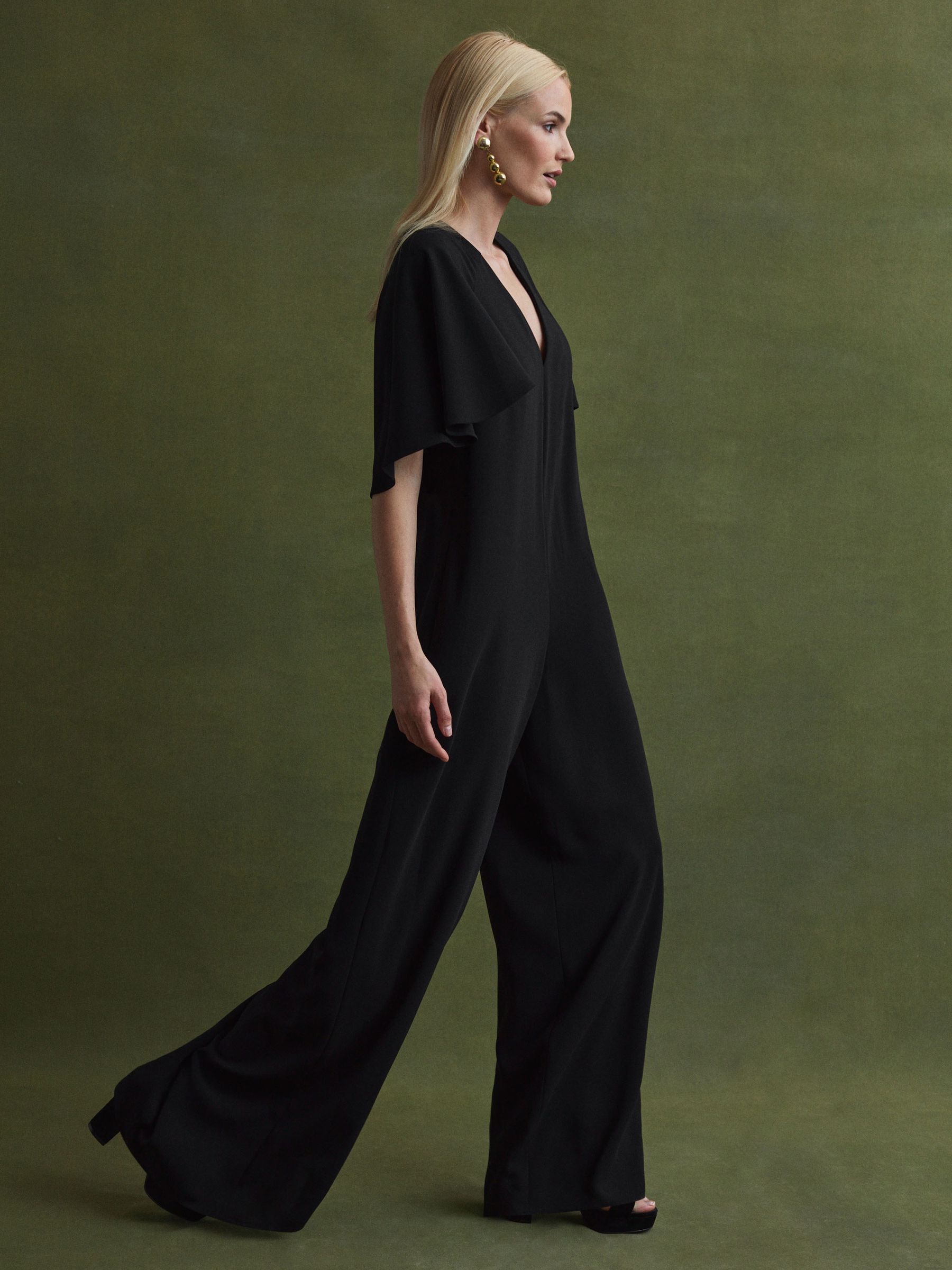 Florere Relaxed Fit Cape Sleeve Jumpsuit in Black