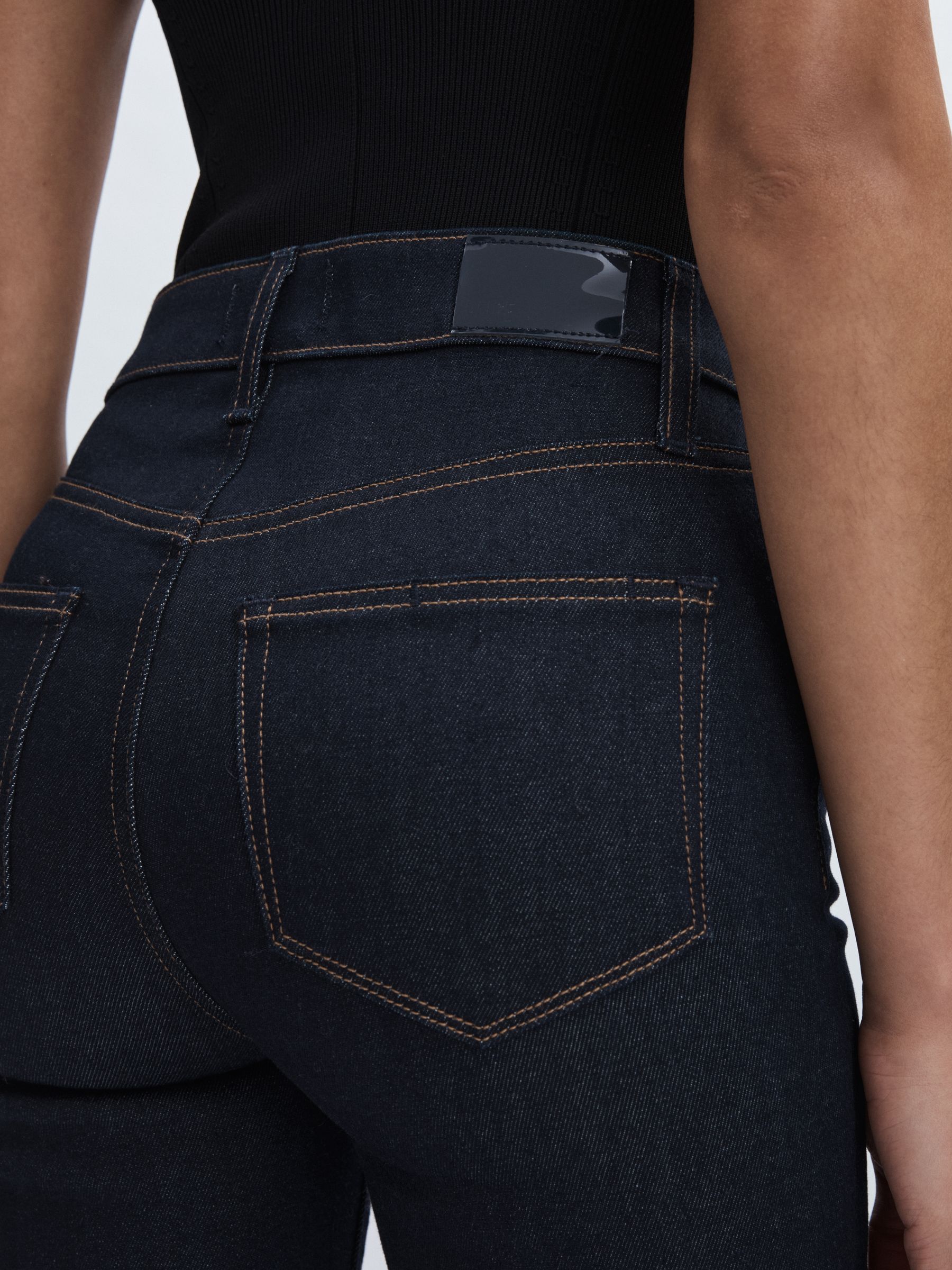 Paige Angled-Waist Flared Jeans in Kira Blue