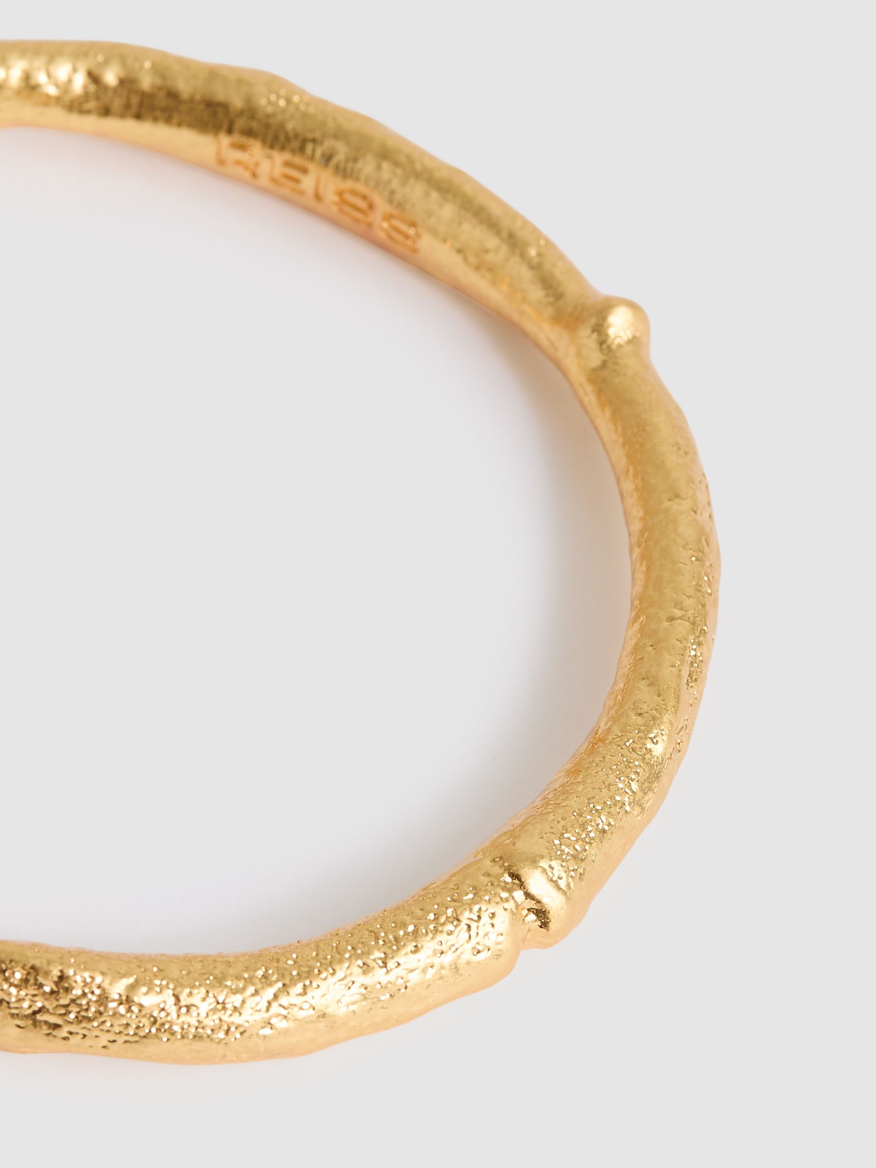 Molten Curve Bangle in Gold Tone