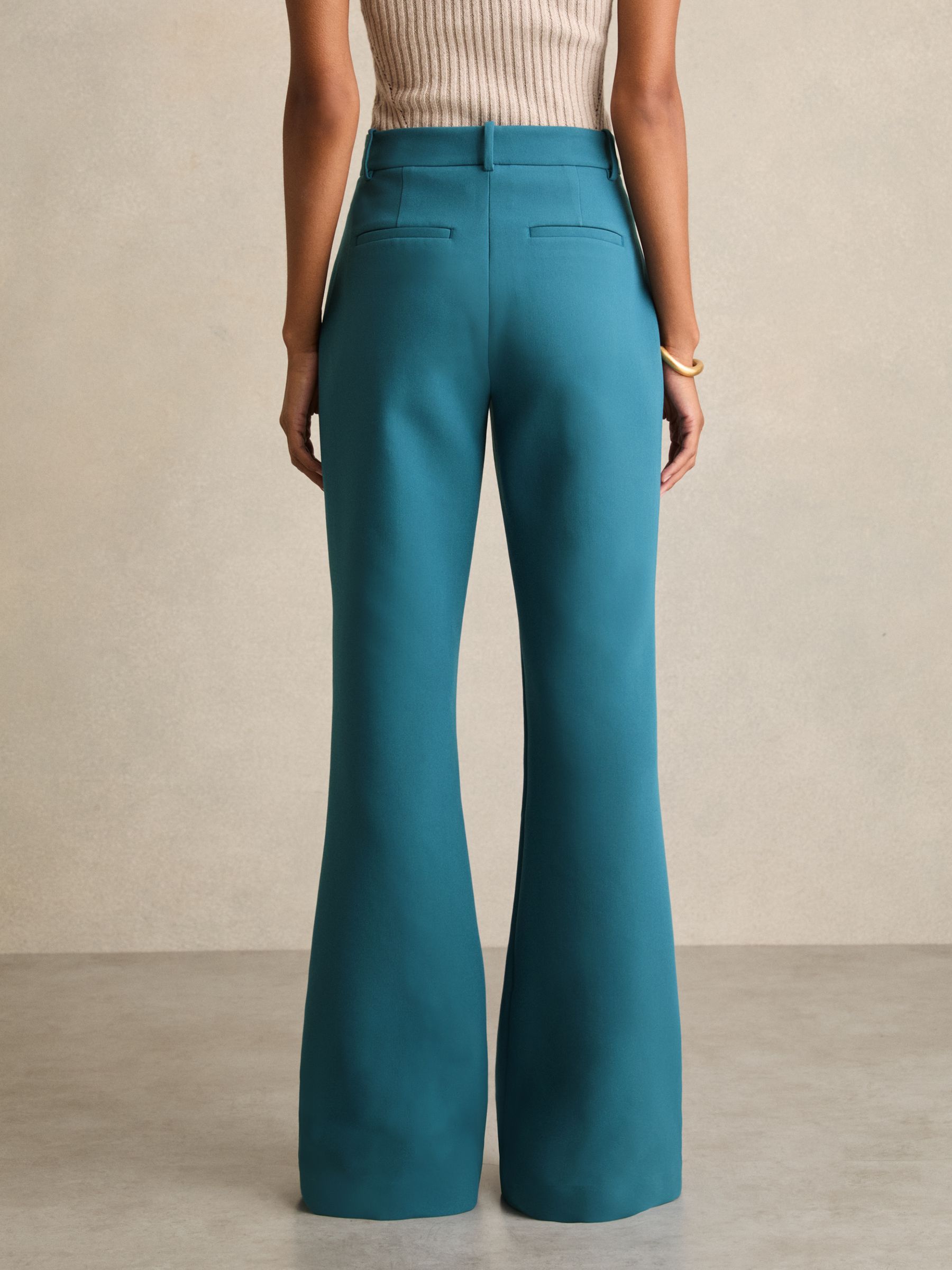 Welt Pocket Flared Trousers in Teal