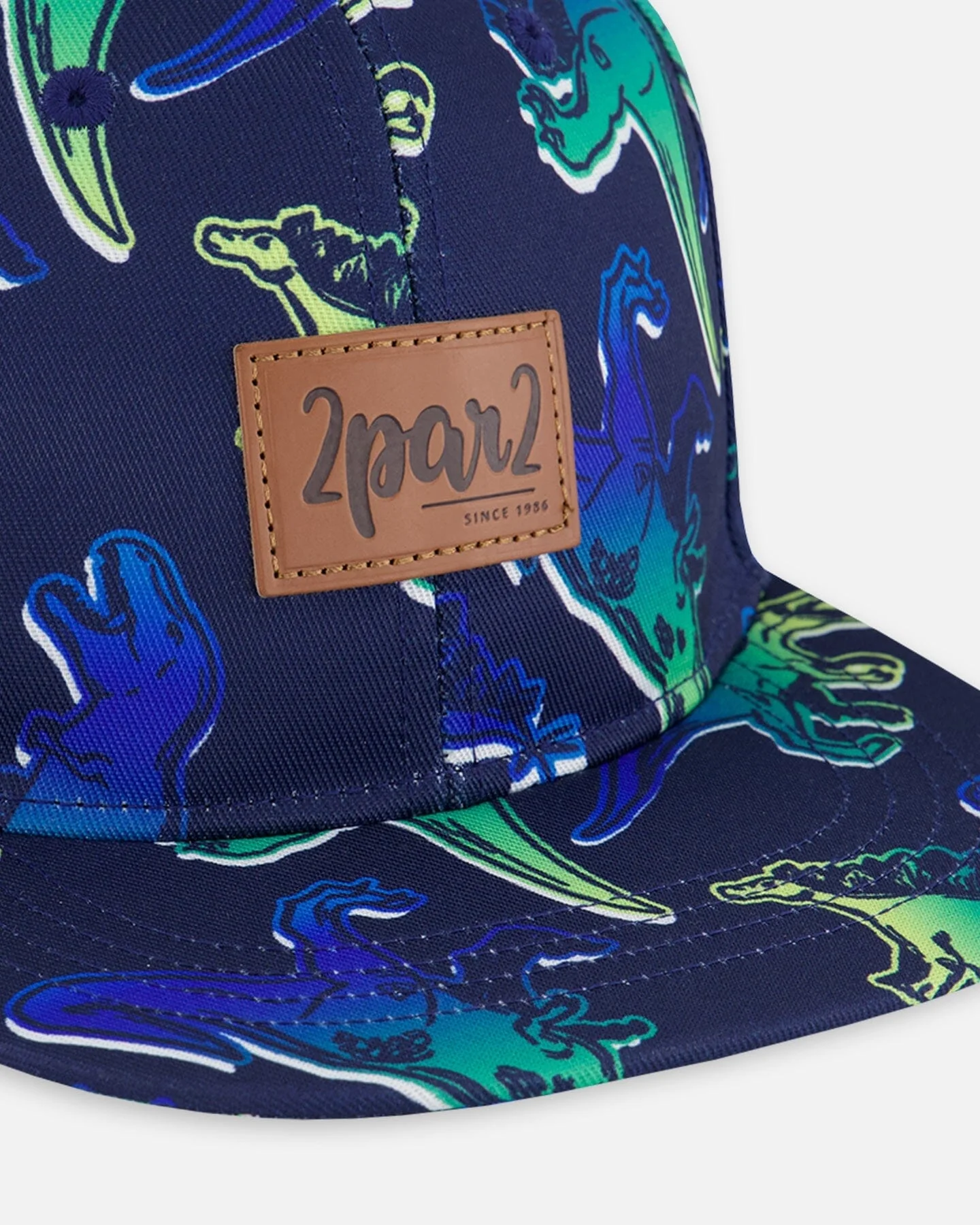 Printed Cap Blue And Green Dino On Navy - Deux par Deux