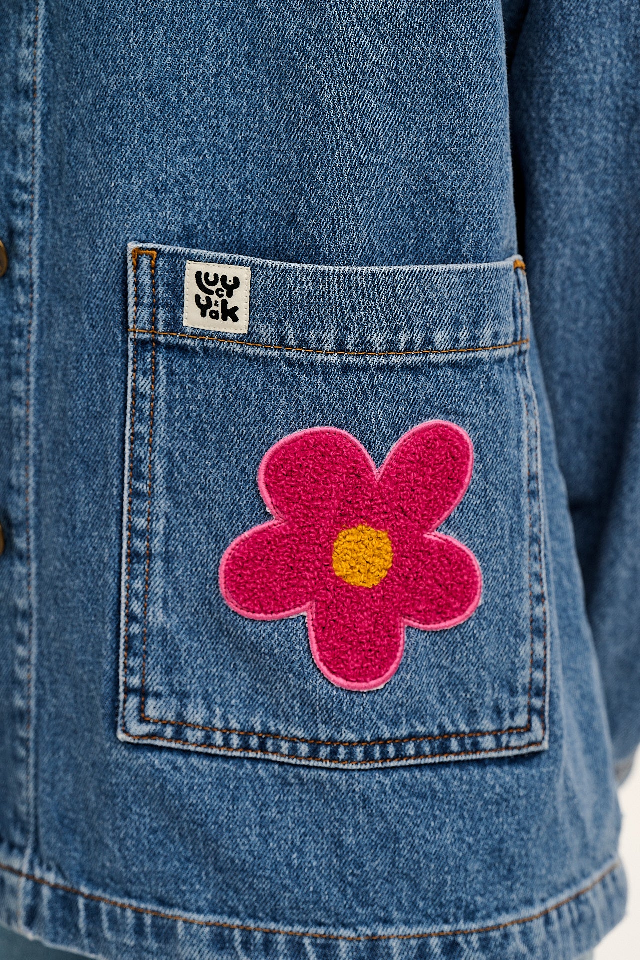 Olly - Denim Jacket in Mid Wash Blue with Pink Flower Motif