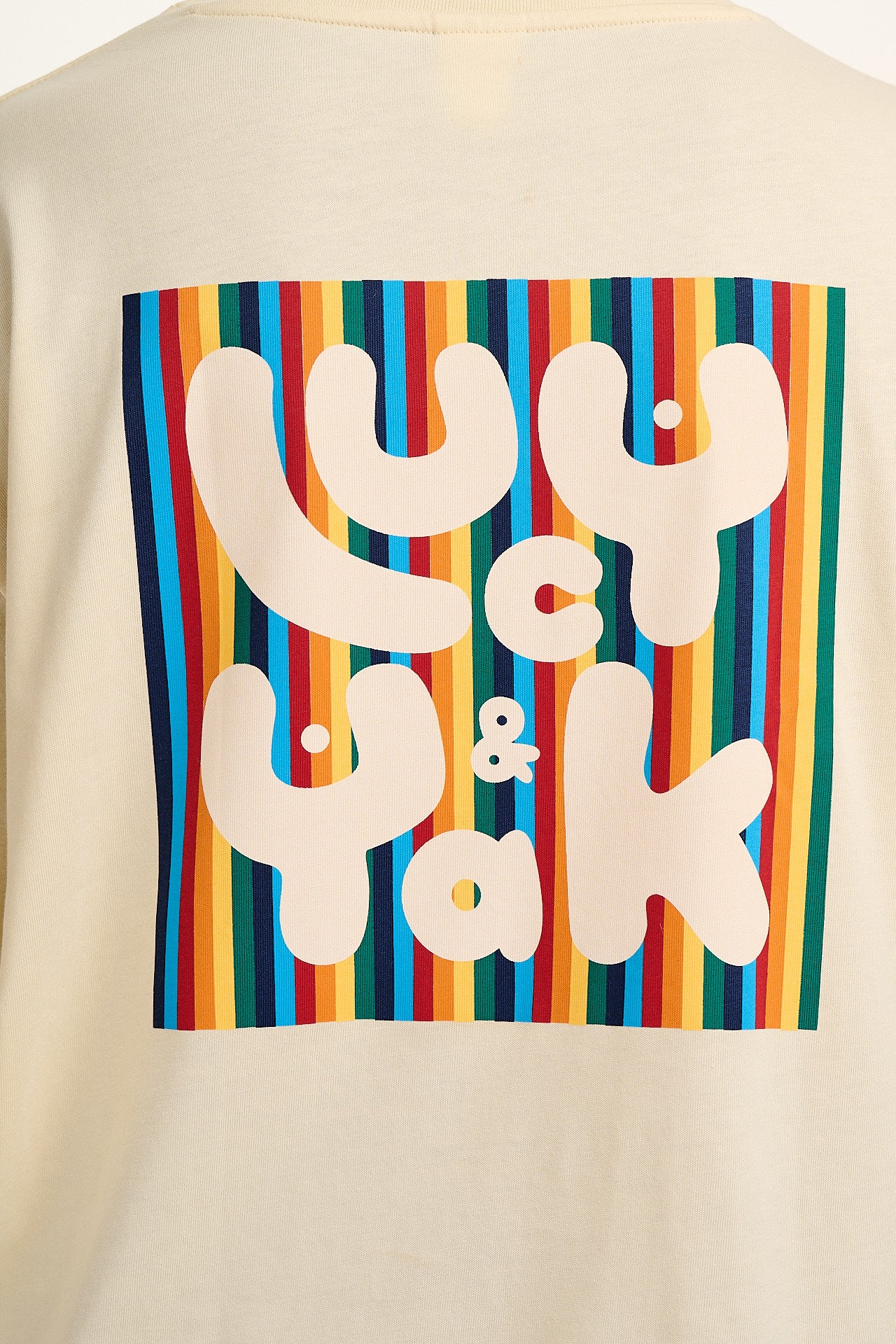 Benny - Organic Cotton Tee in Ecru with Logo Rainbow Stripe Print