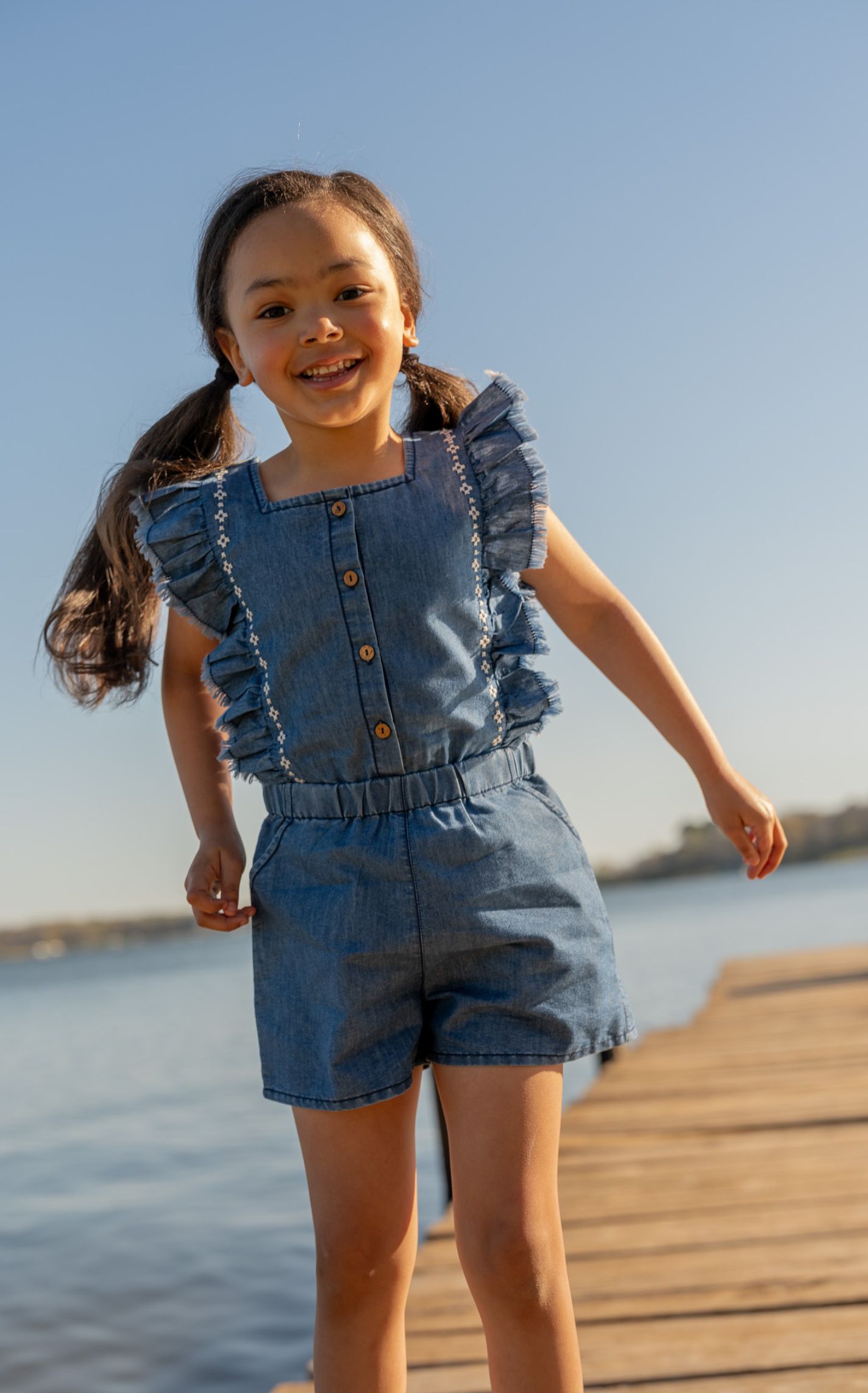 Rockin' C Girl's Medium Wash Aztec Embroidered Denim Romper - Image 1