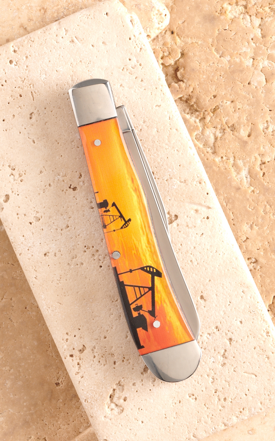 Circle SH Cutlery Acrylic Orange Pumpjack Print Trapper Knife - Image 1