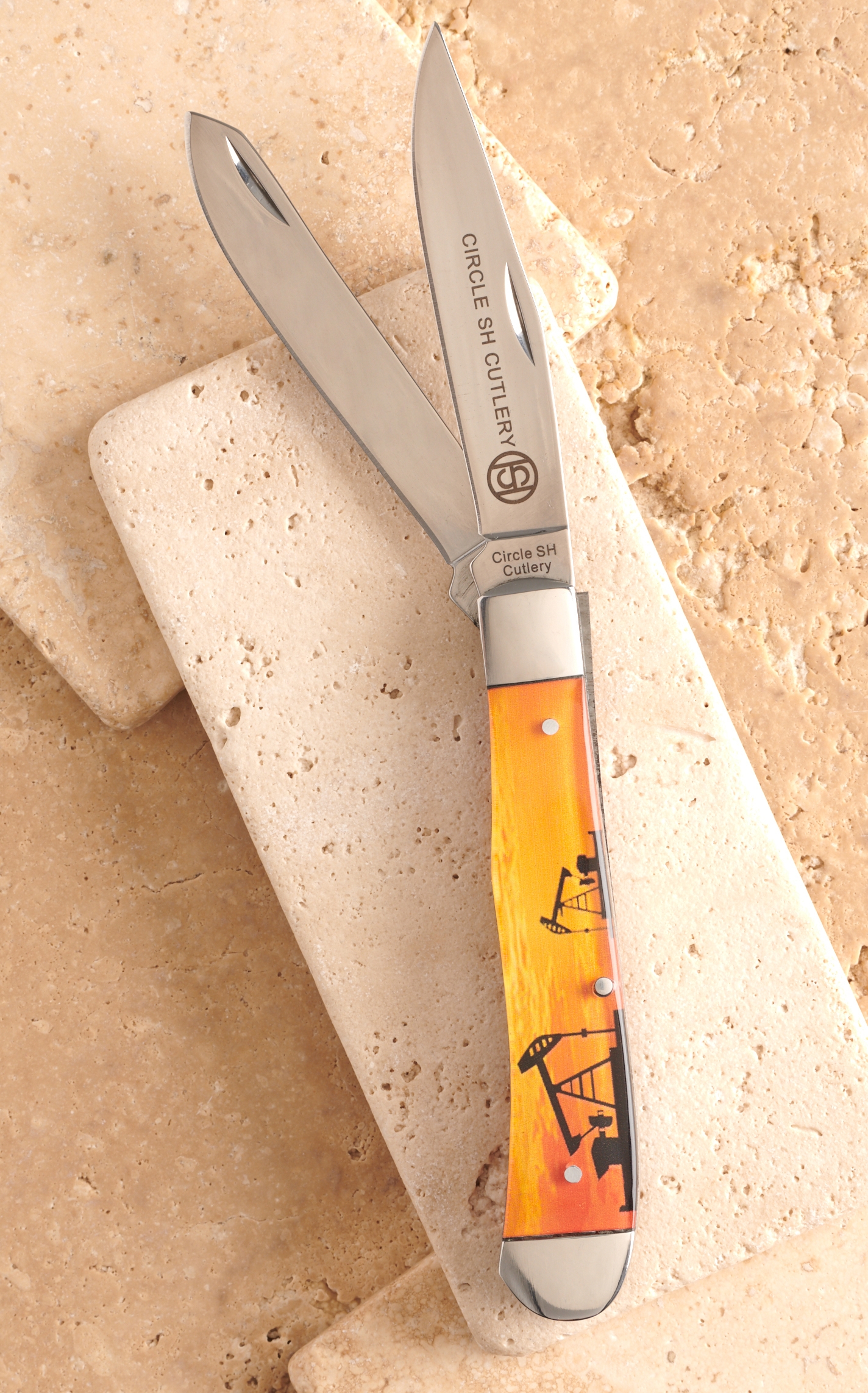 Circle SH Cutlery Acrylic Orange Pumpjack Print Trapper Knife - Image 1