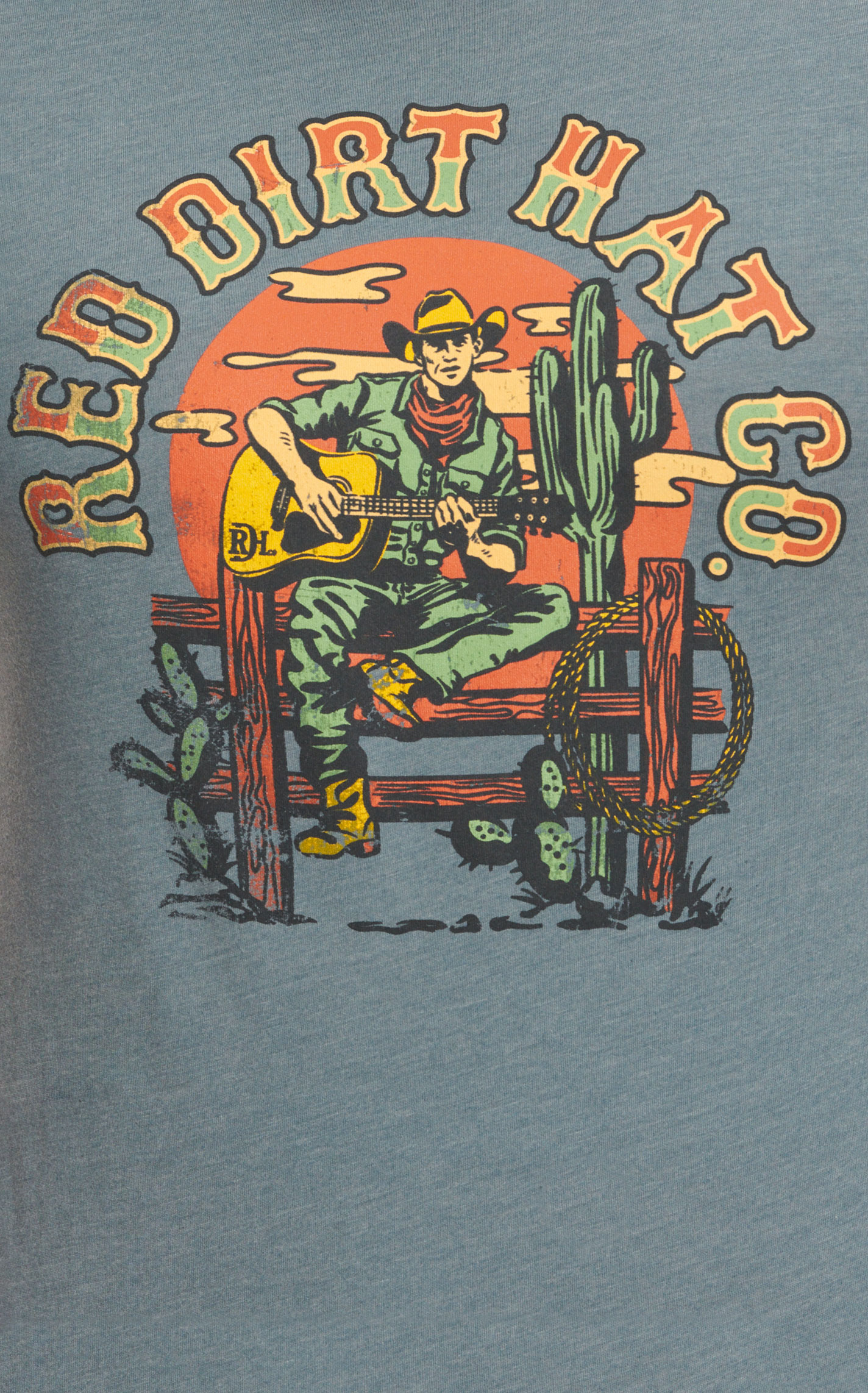 Red Dirt Hat Co. Men's Stone Blue Singing Cowboy Logo Graphic Short Sleeve T-Shirt - Image 1