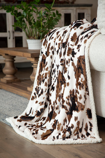 Carstens Cinnamon Cream and Chocolate Cow Print Throw - Image 1