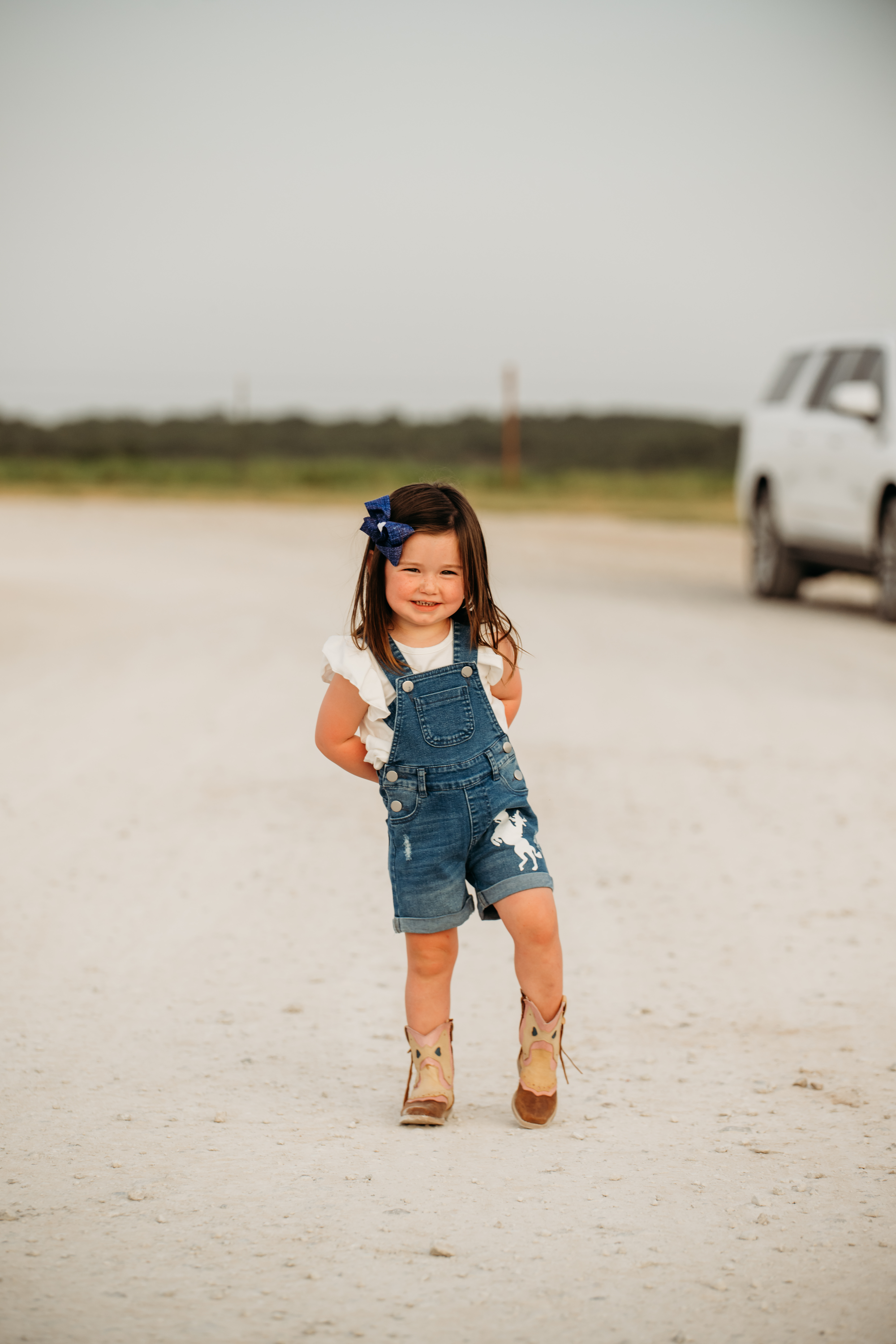 Shea Baby Toddler Girl's Distressed Denim Overall Shorts  - Image 1