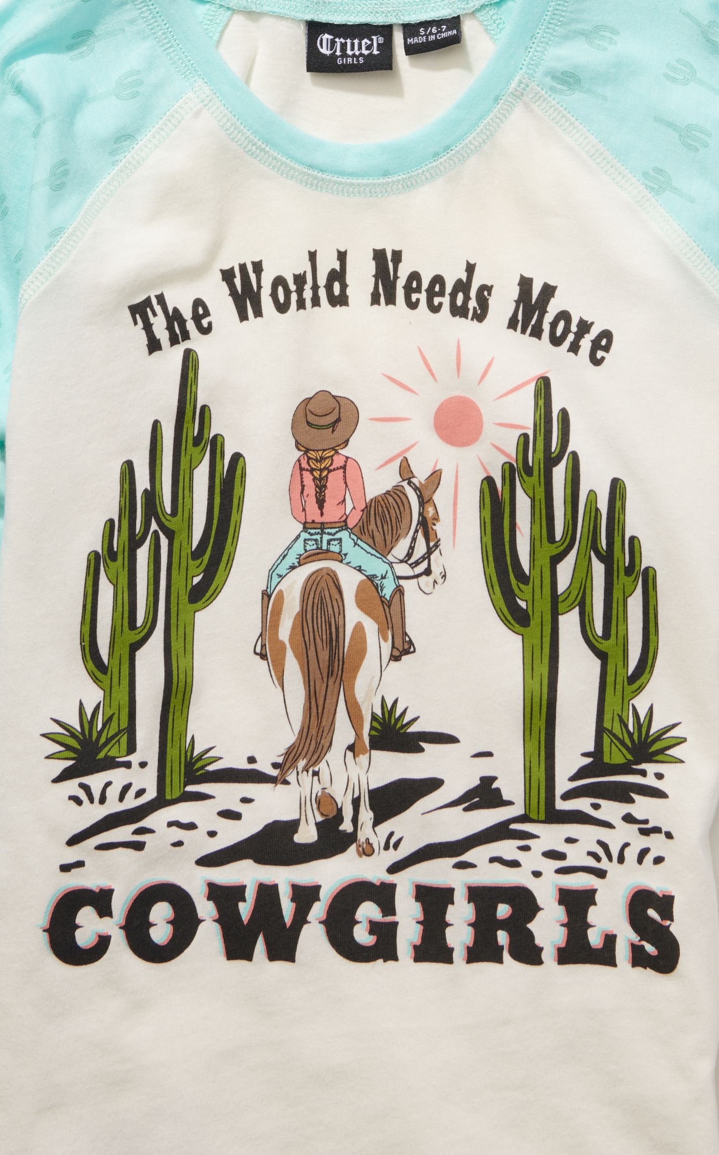 Cruel Girl Girl's White The World Needs More Cowgirls Graphic Sea Green Ragland Sleeve T-Shirt - Image 1