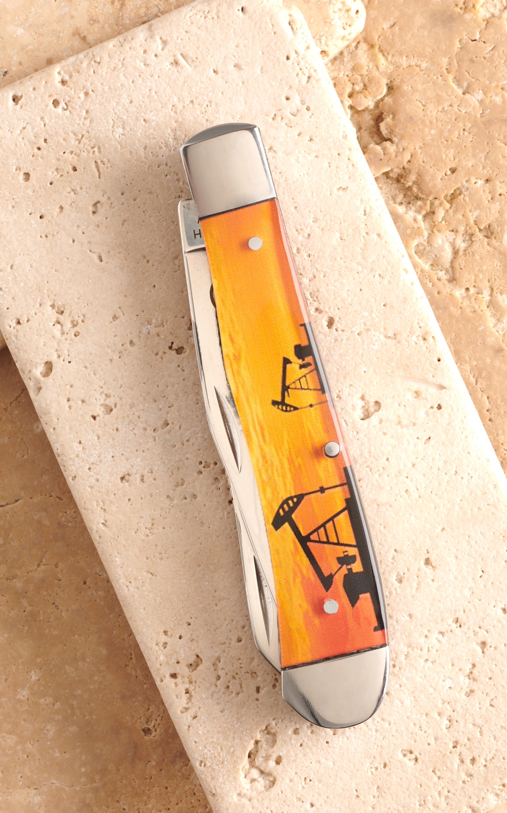 Circle SH Cutlery Acrylic Orange Pumpjack Print Trapper Knife - Image 1