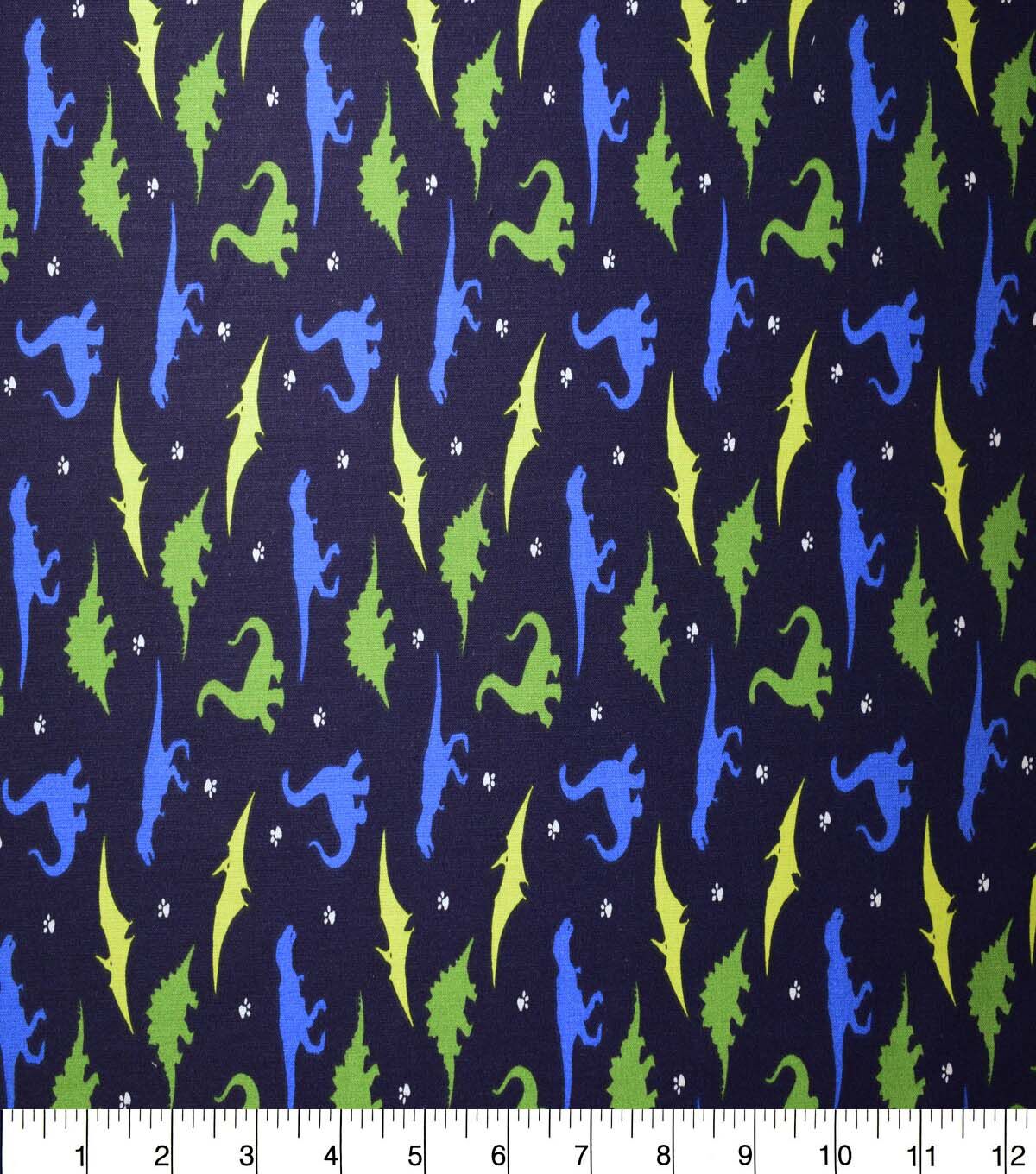 Dinosaur Silhouettes on Dark Blue Cotton Fabric by Quilter's Showcase