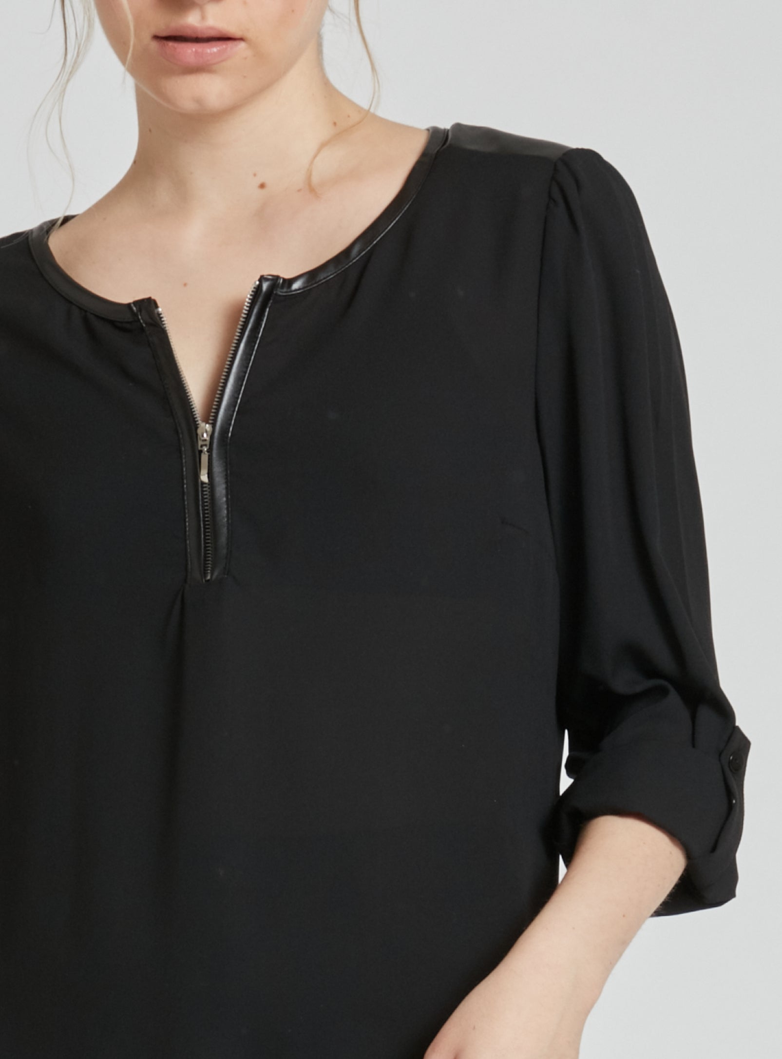 GISELE | Long sleeve blouse with zipper at neckline opening and P.U. accents. || GISELE | Chemisier à manches longues avec fermeture éclair à l'ouverture de l'encolure et P.U. accents.