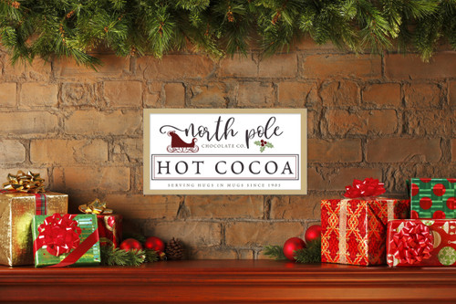 North Pole Chocolate Company Hot Cocoa 10.5" x 19.5" Framed Christmas Wall Decor  Sign Poster in a Natural Wooden Frame with UV Acrylic and Hangers